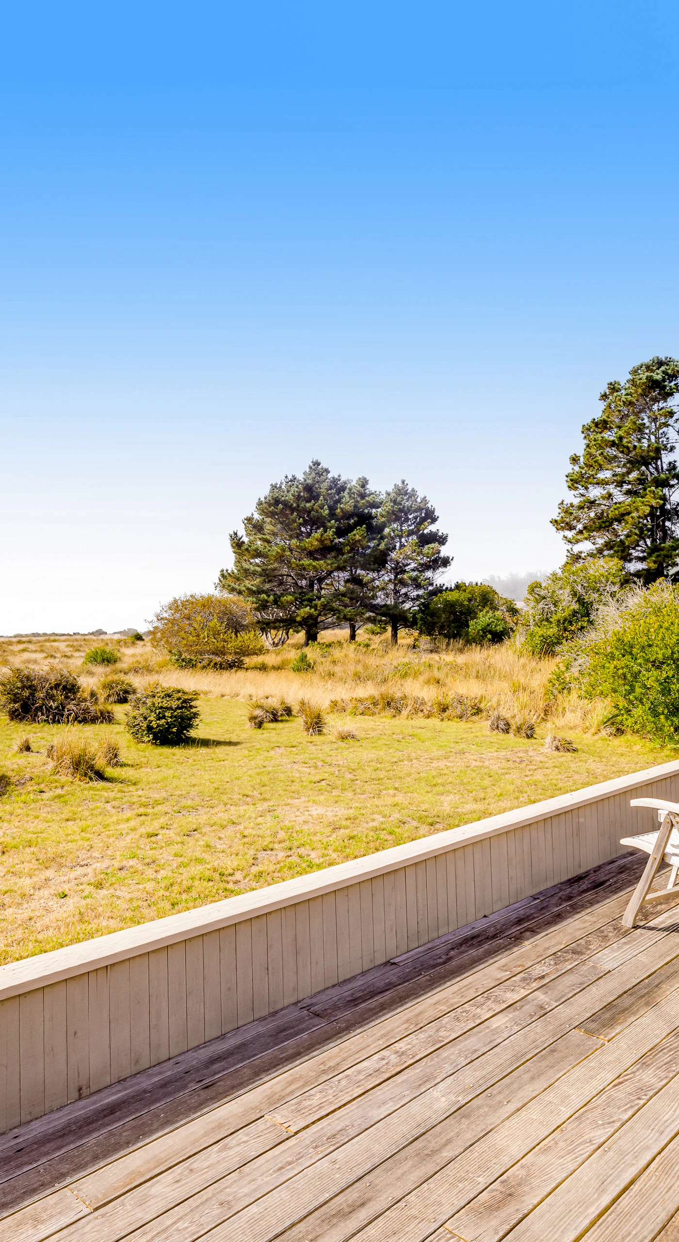 Enjoy quiet moments on the deck, where gentle coastal breezes and open skies create the ideal backdrop for relaxation.