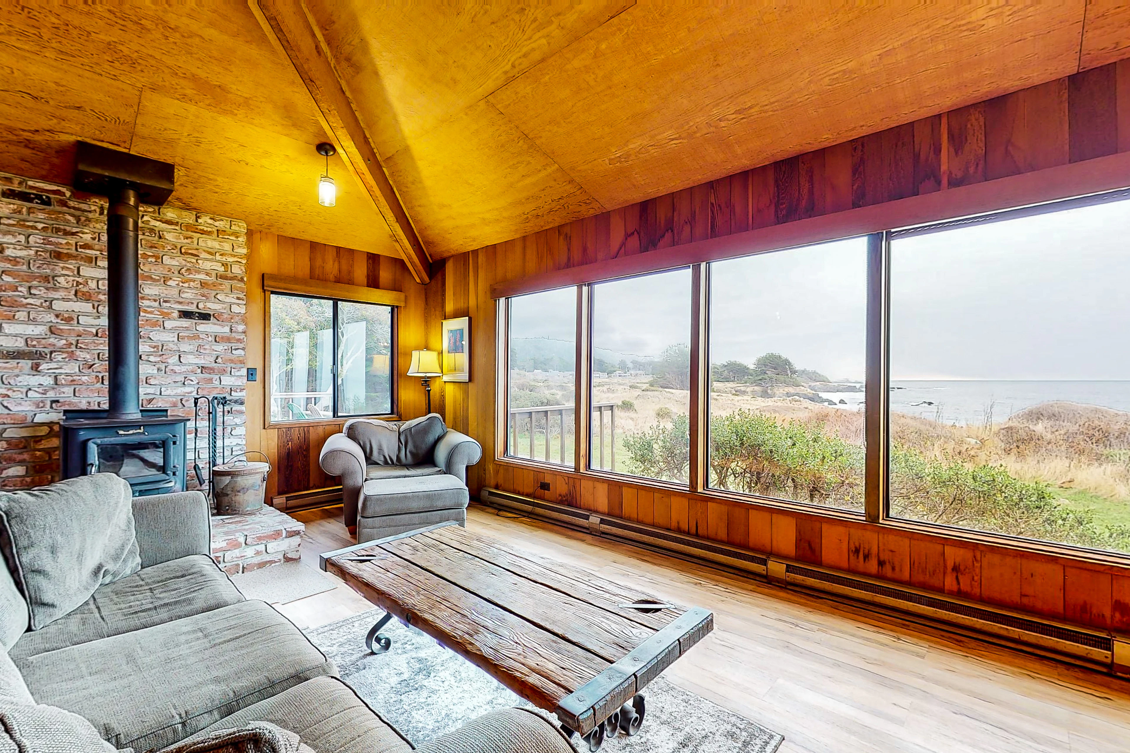 Cozy up by the wood-burning fireplace, where the ocean views invite you to unwind and create lasting memories.