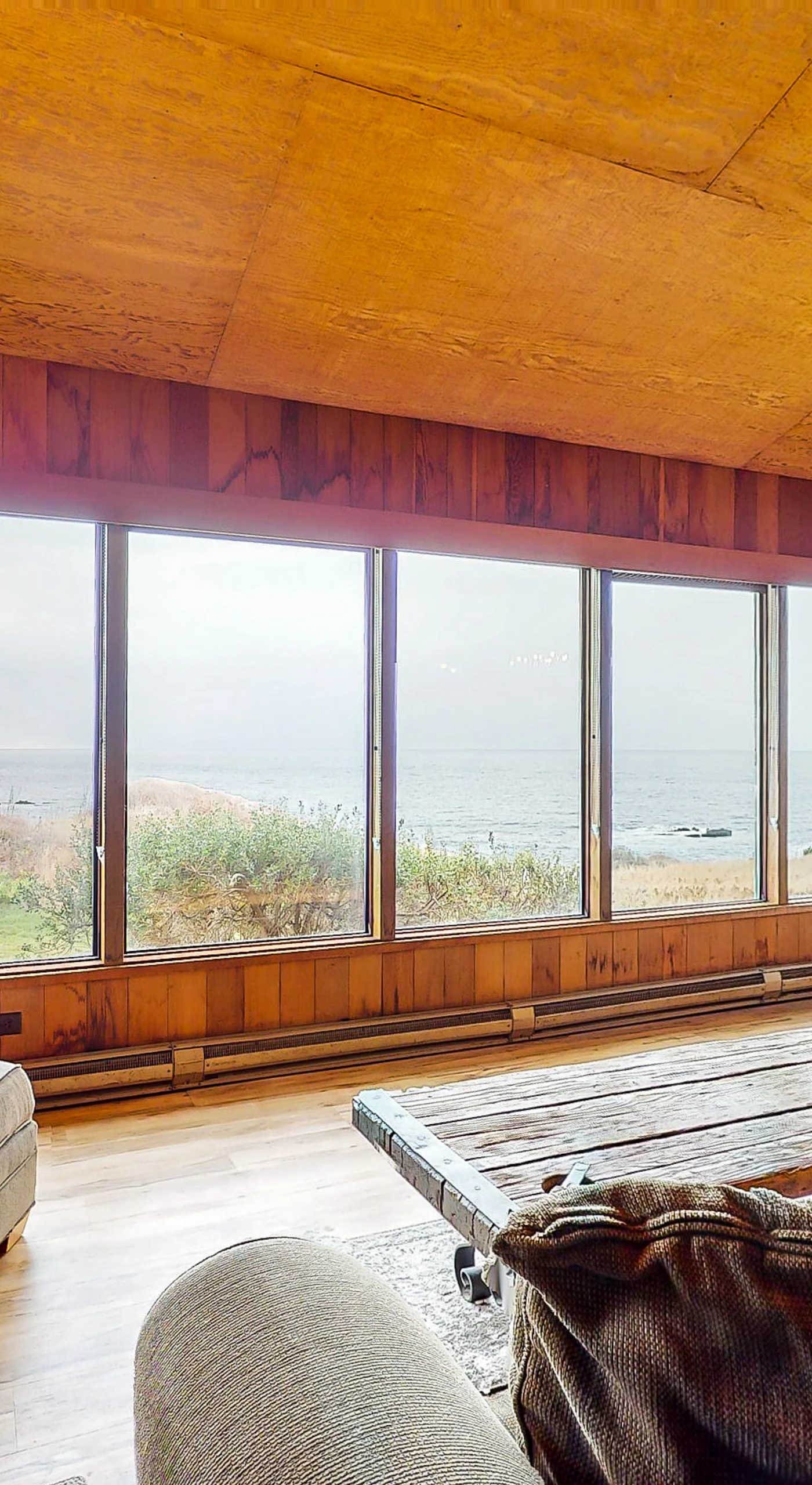 Imagine sipping your morning coffee here, with the gentle ocean waves just beyond the expansive windows.