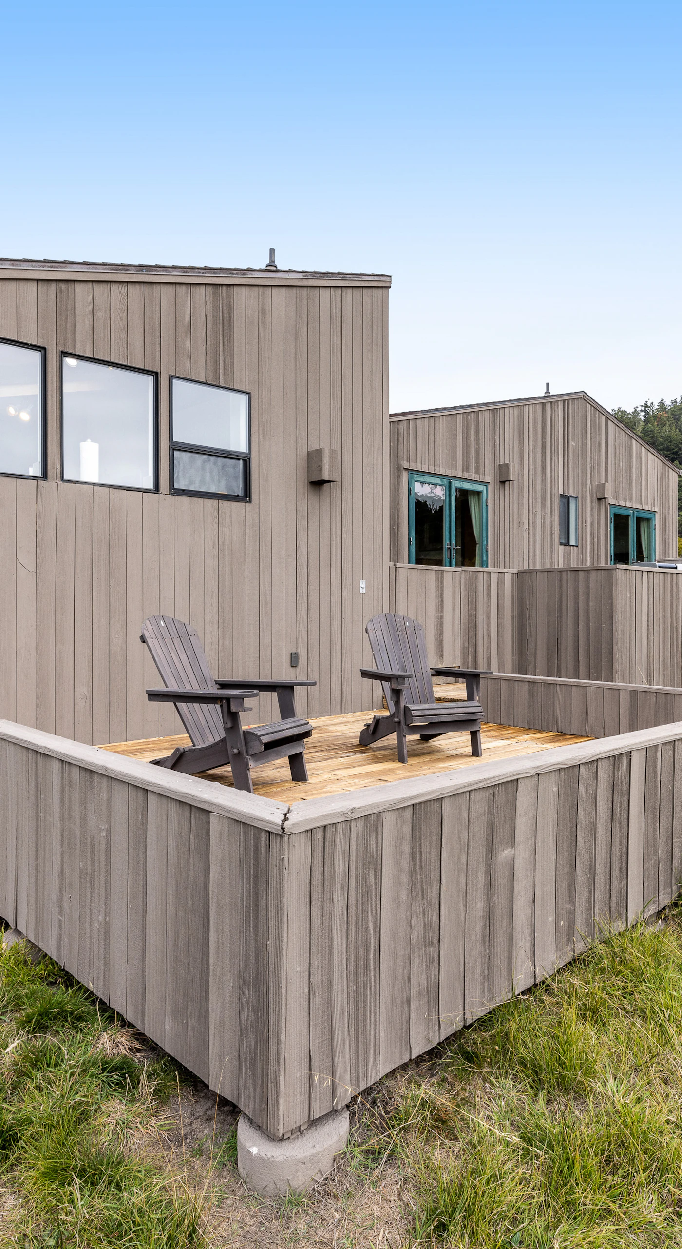 Unwind on the private deck, where comfortable seating invites you to relax and enjoy the peaceful surroundings.