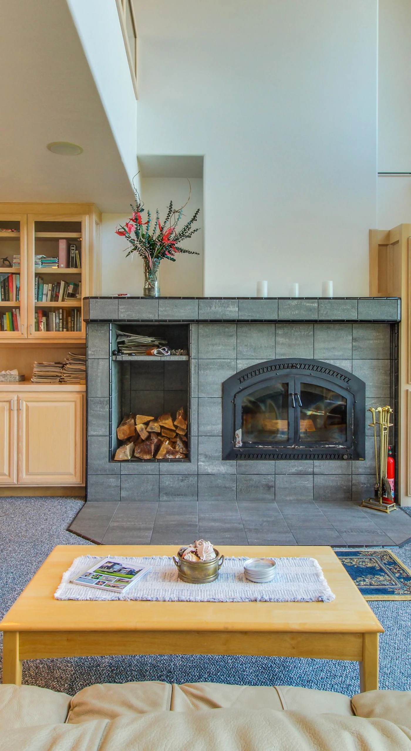 Gather around the wood-burning fireplace in the cozy living room, a perfect spot for storytelling and warmth after a day of exploration.