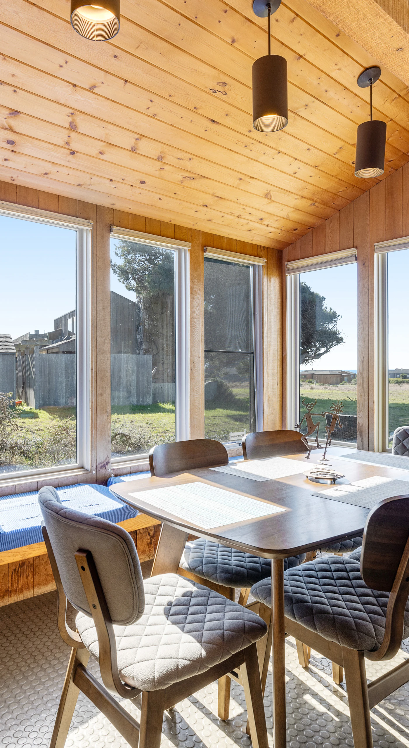 Share meals and laughter in the dining area, where large windows frame the picturesque scenery, making every meal a special occasion.