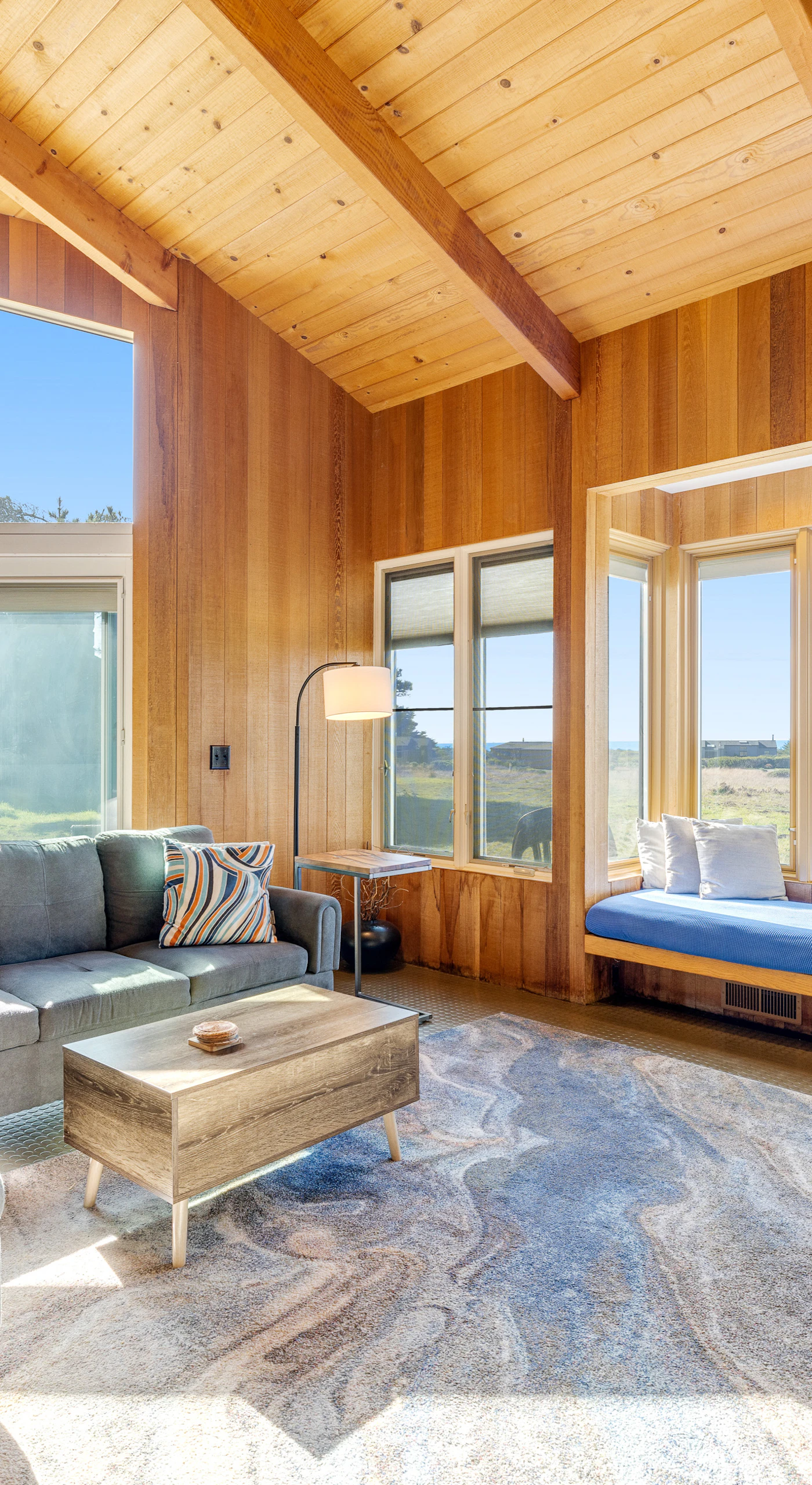 Morning light fills the spacious living room, creating a warm and inviting space for family gatherings or quiet reflection.
