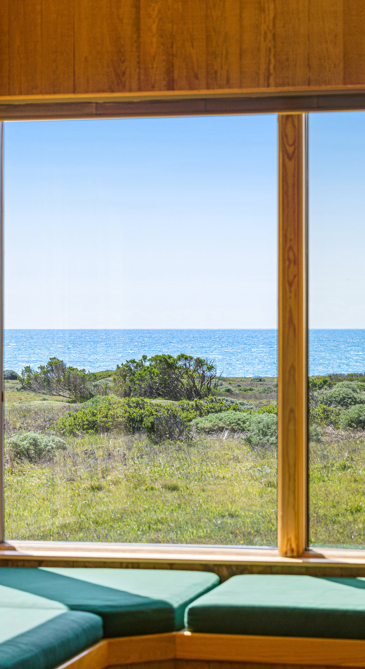 Imagine sipping your morning coffee while soaking in the stunning ocean view from this sunlit window seat.