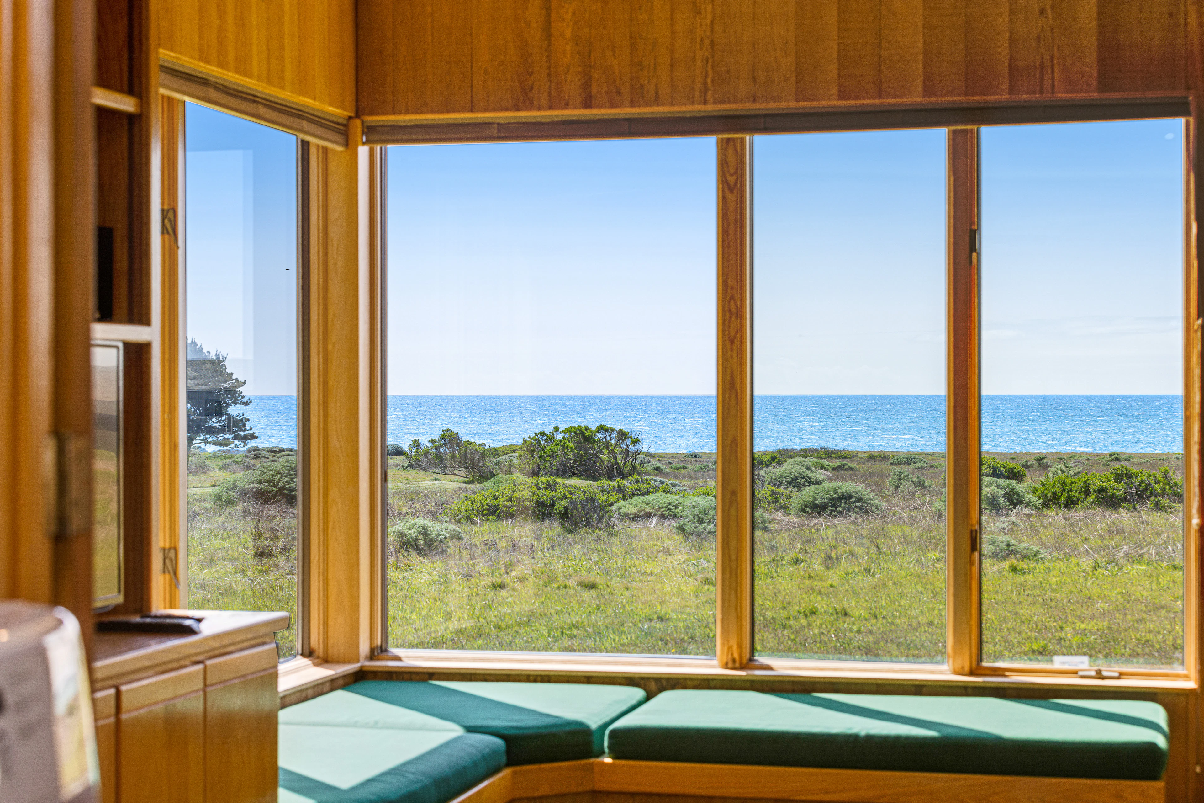 Imagine sipping your morning coffee while soaking in the stunning ocean view from this sunlit window seat.