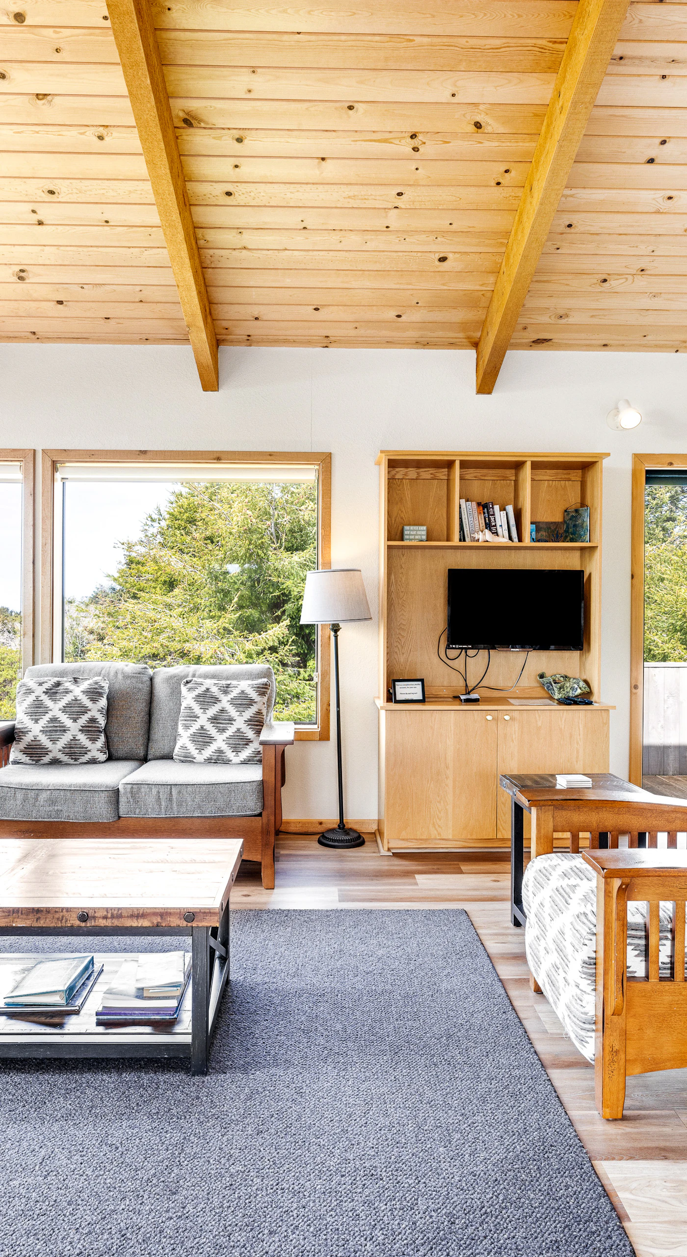 Bask in panoramic views from your living room, where large windows frame the beauty of Sea Ranch’s natural landscape.