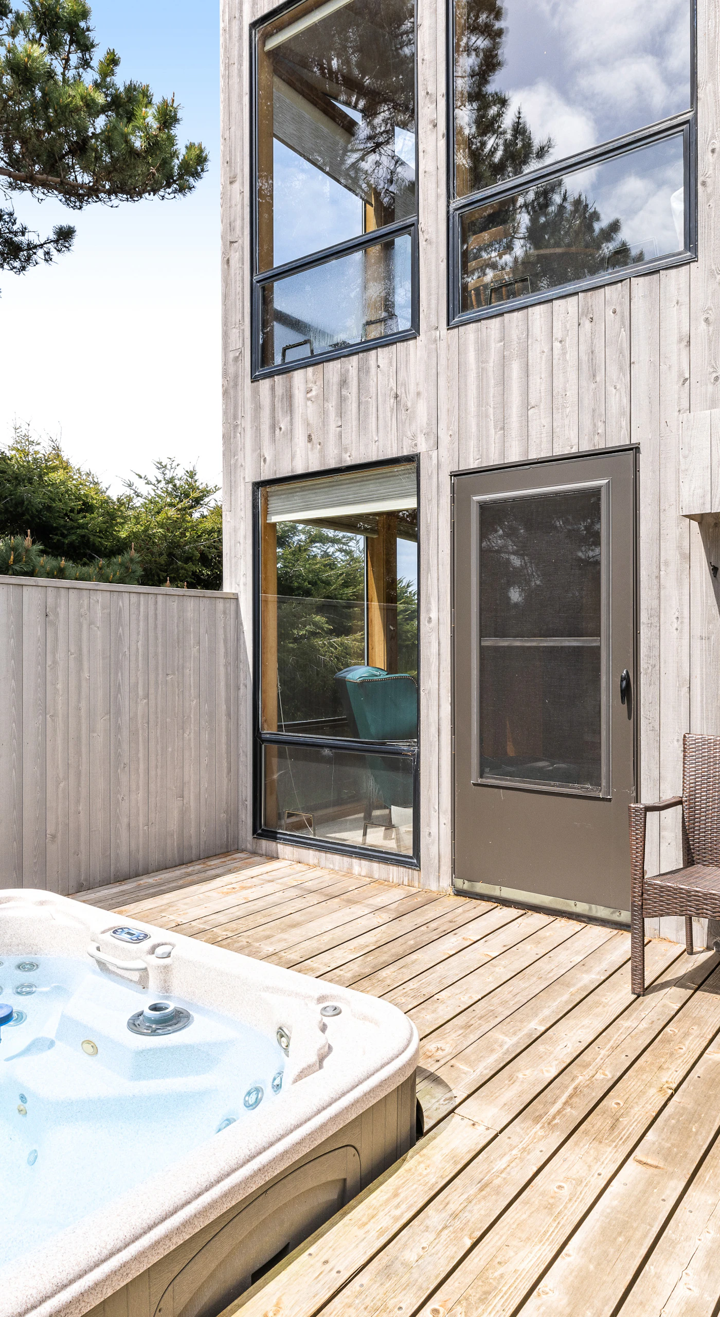 Savor the soothing bubbles of your private hot tub, where relaxation meets nature in this tranquil outdoor retreat.