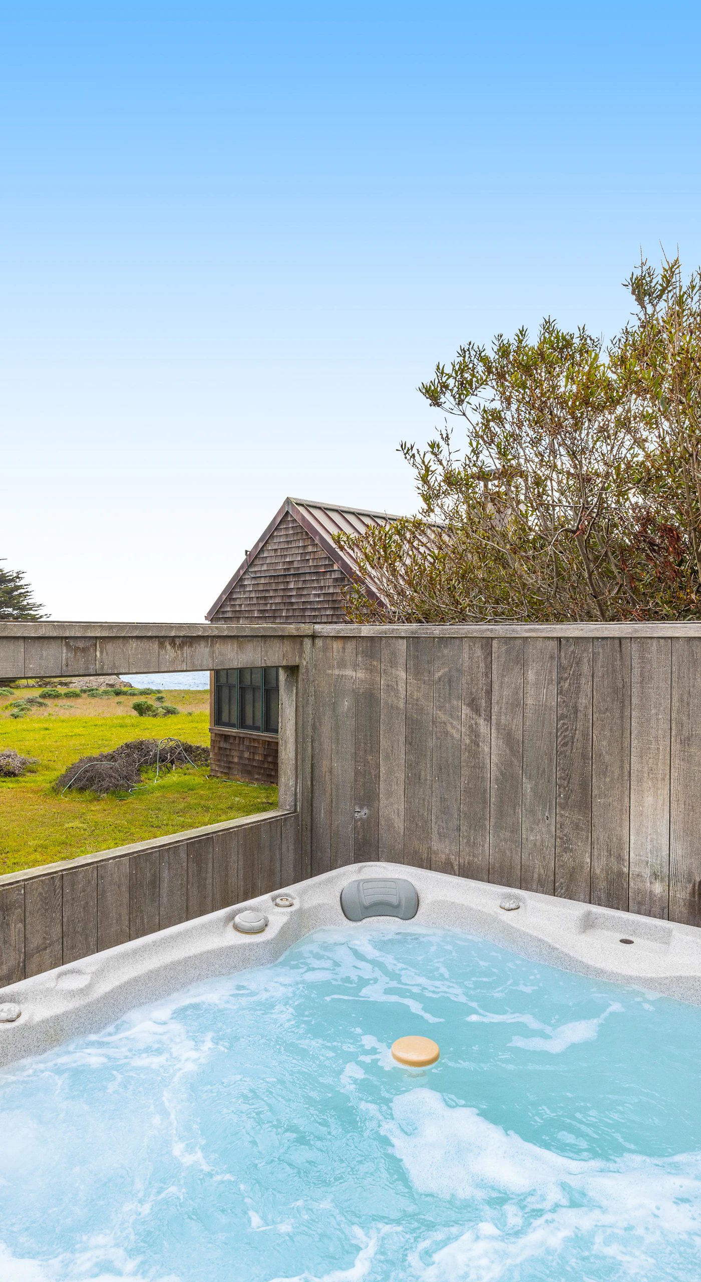 Relax in the hot tub, where the warm bubbles and stunning ocean views create a perfect retreat after a day of adventure.