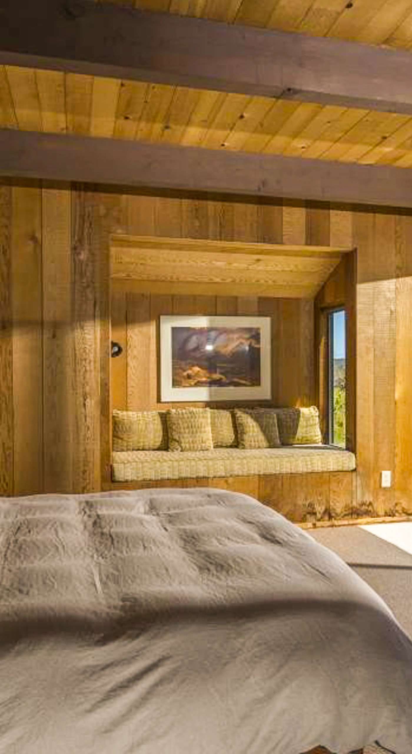 Awake to breathtaking views in this spacious master suite, where comfort and tranquility blend seamlessly with the beauty of the outdoors.