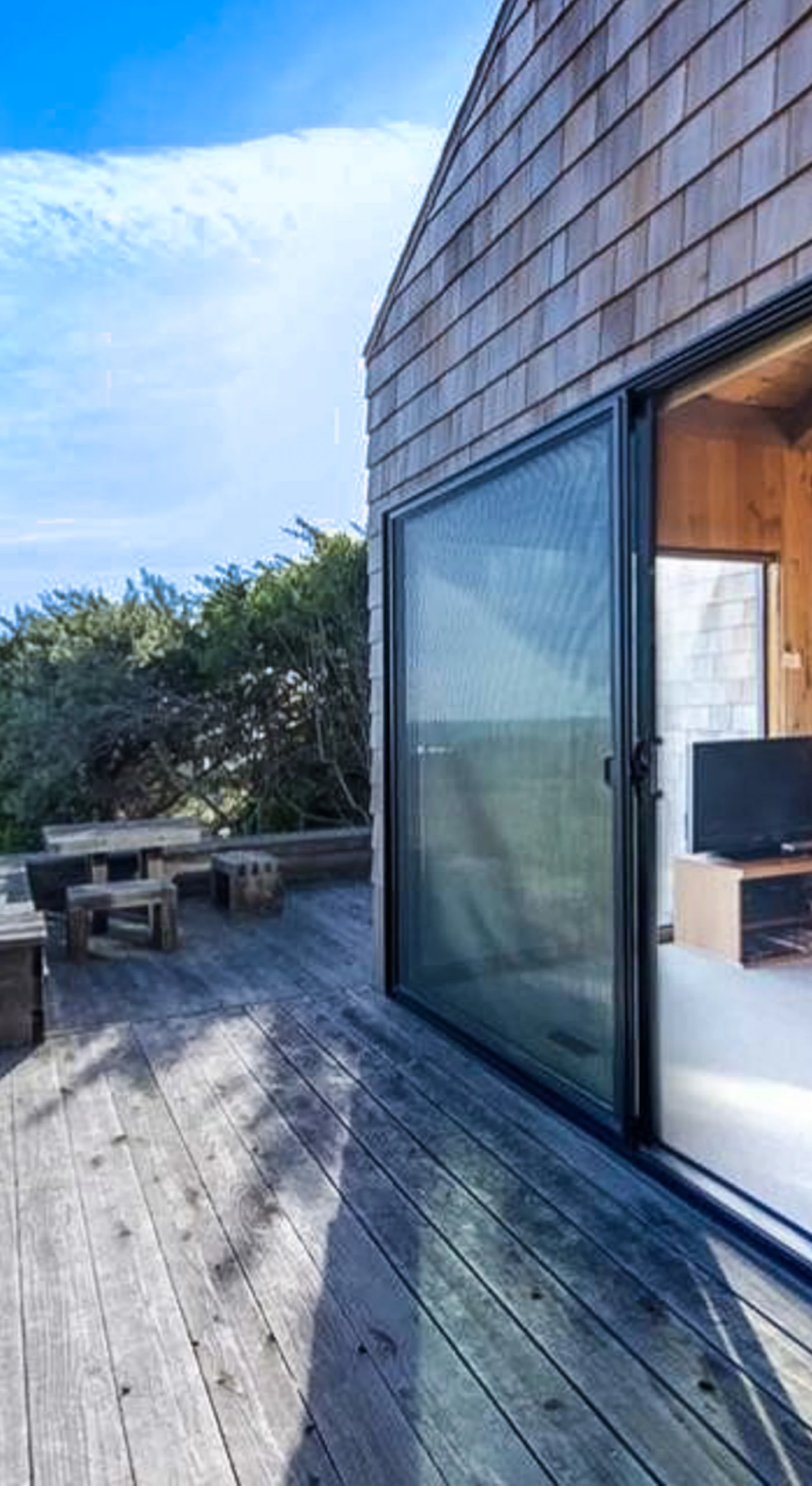 Step outside to the deck and breathe in the fresh coastal air, where stunning ocean views set the scene for unforgettable moments.