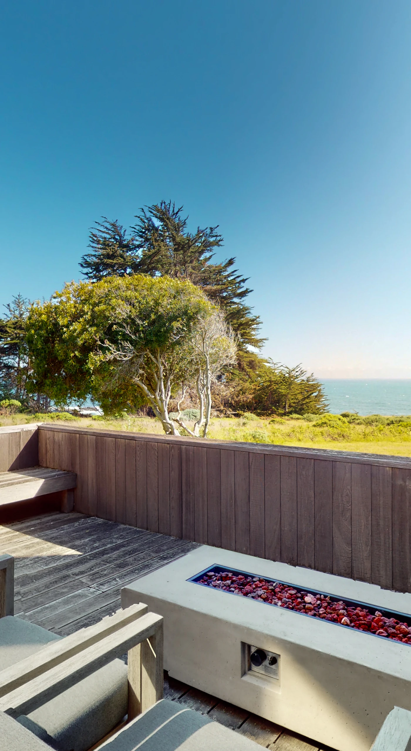 Step onto the deck and breathe in the fresh ocean air while lounging by the fire pit, perfect for evening gatherings under the stars.