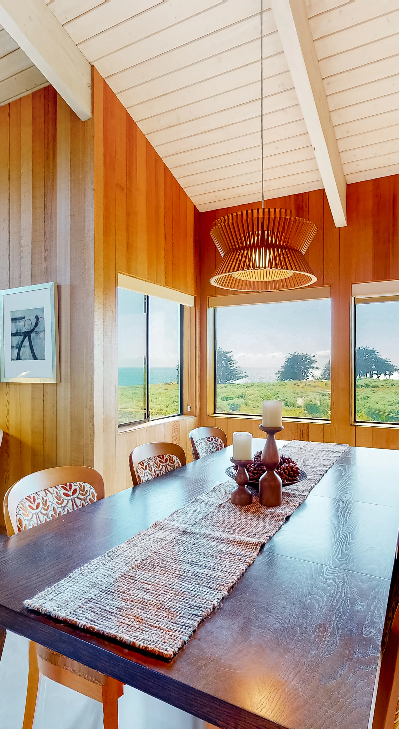 Gather around the dining table, where ocean views enhance every meal, making each dining experience feel like a special occasion.