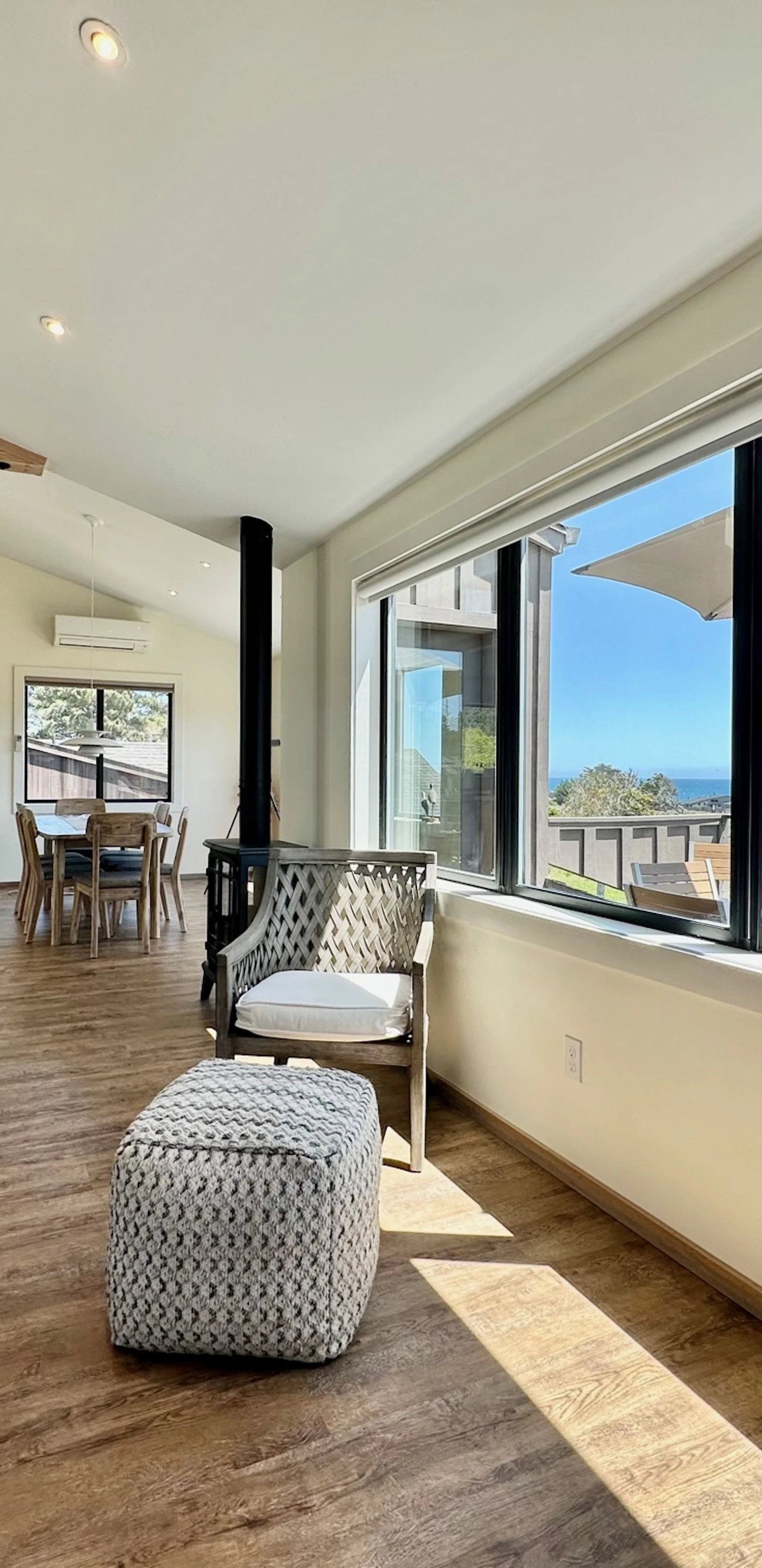 Bask in the warmth of natural light as you relax in the living room, where panoramic ocean views set the perfect ambiance for your getaway.