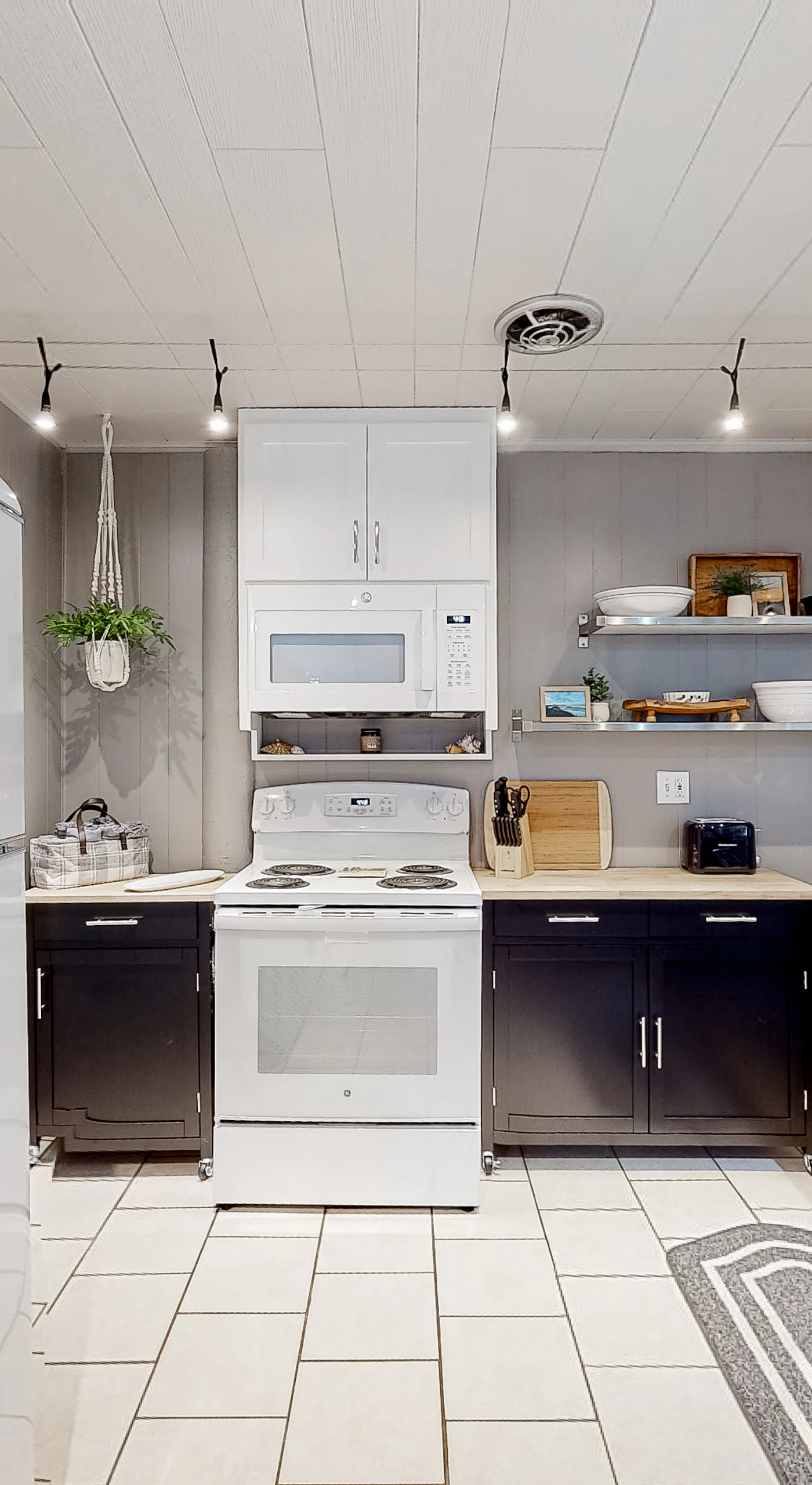 The kitchen’s retro charm invites you to whip up delicious meals while soaking in the cozy atmosphere, making every culinary moment memorable.