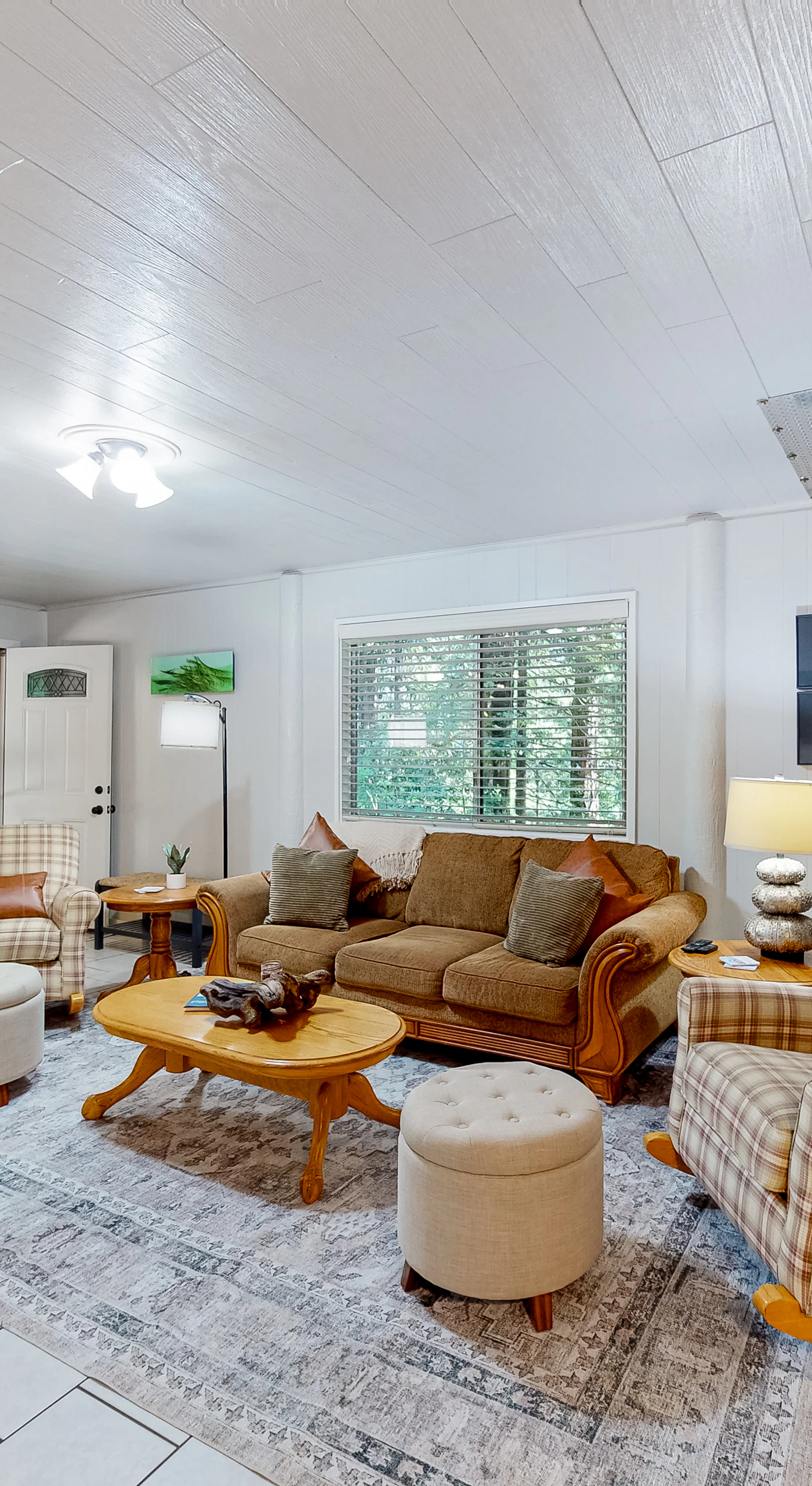 The perfect spot for family gatherings, this living area blends comfort with a touch of rustic charm.