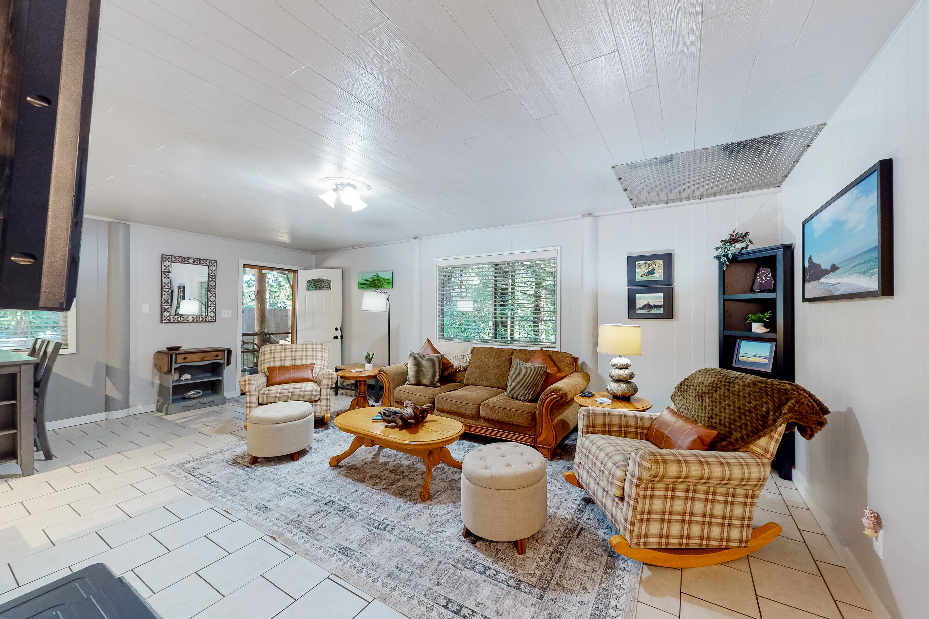 The perfect spot for family gatherings, this living area blends comfort with a touch of rustic charm.