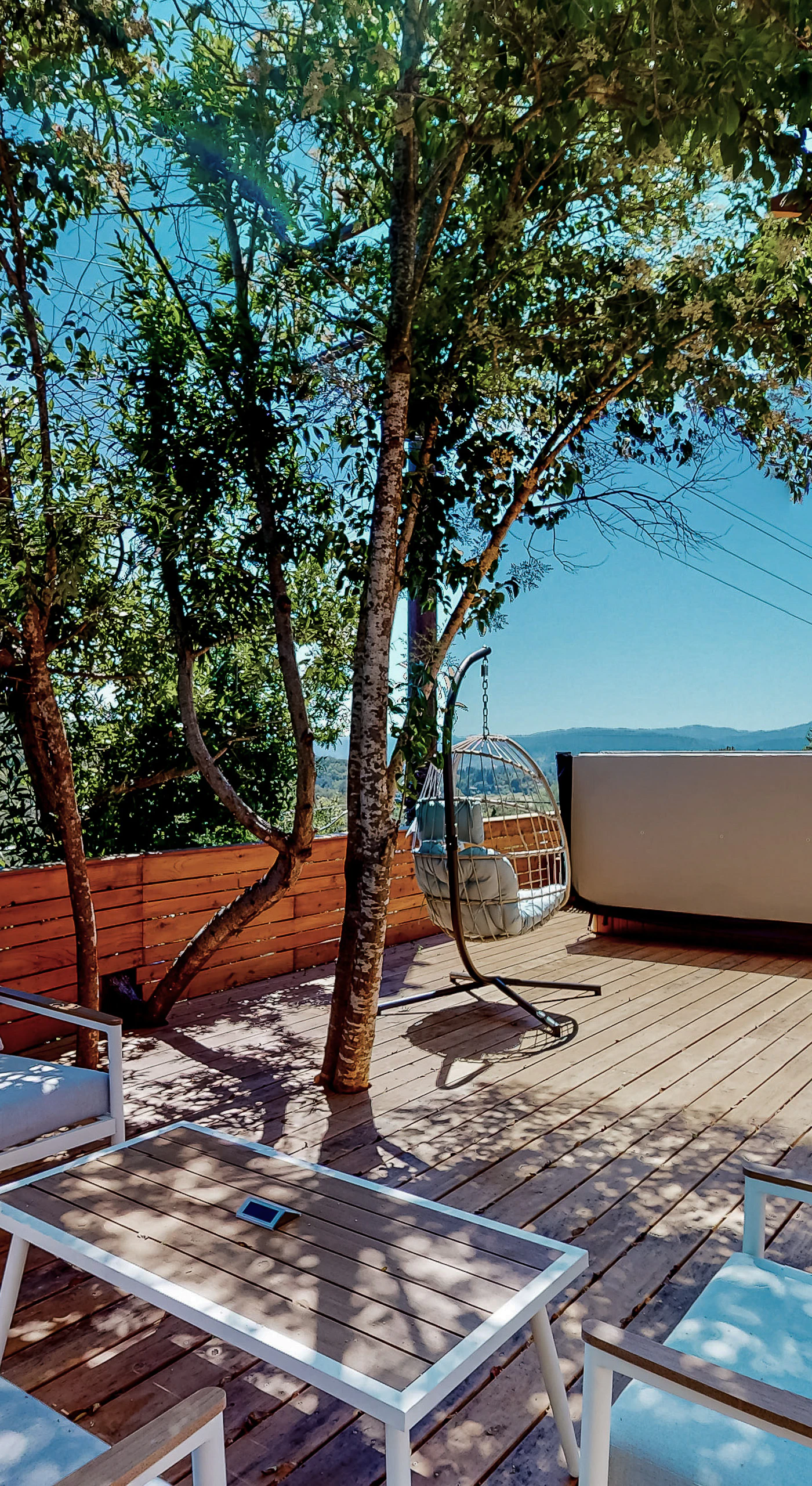 Kick back on your private hilltop deck where panoramic mountain views stretch across Sonoma wine country — your morning coffee spot just got an upgrade.