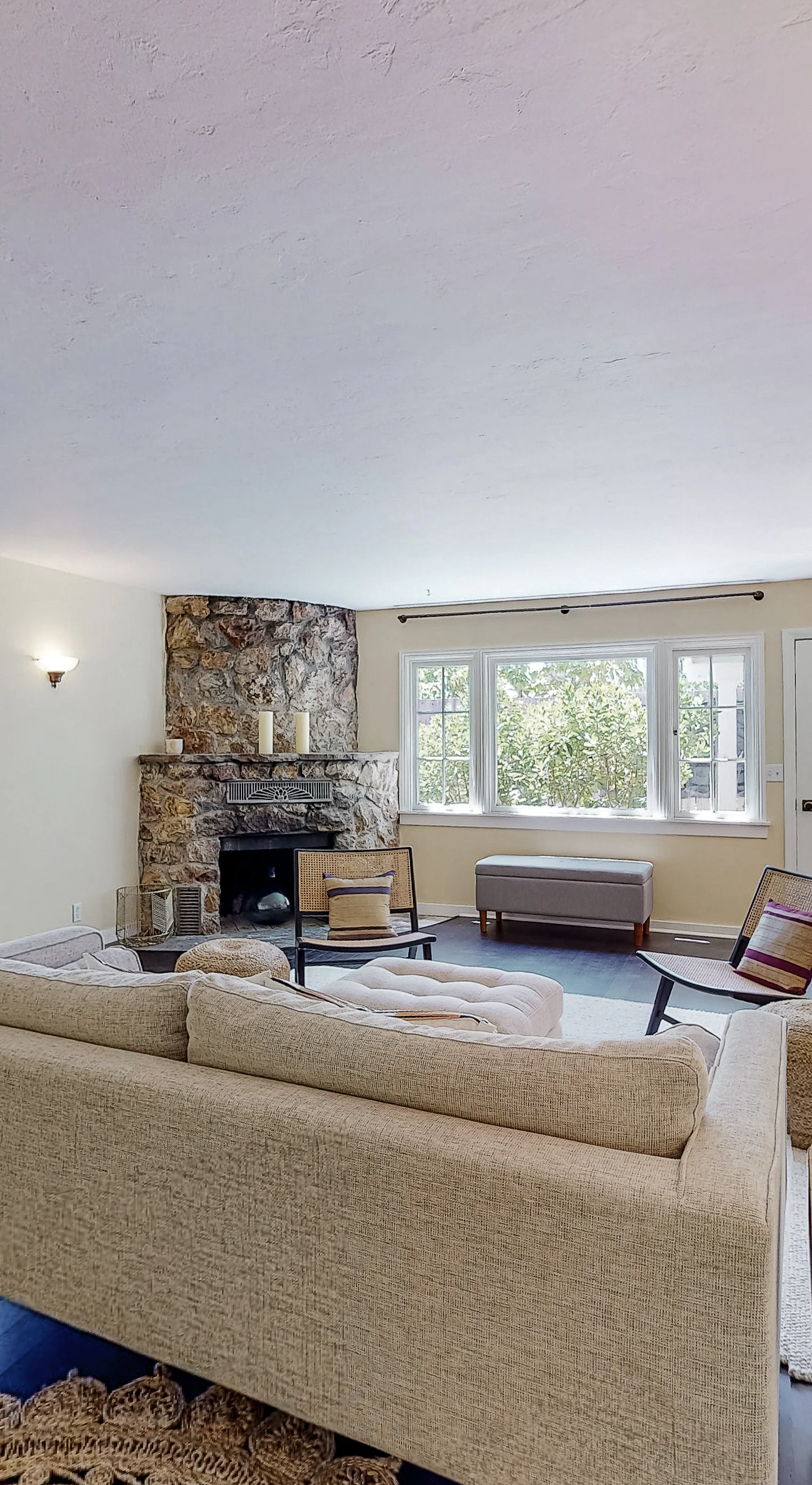 Stretch out in your light-filled living room where natural stone meets modern comfort — a welcoming retreat after strolling Healdsburg Plaza.
