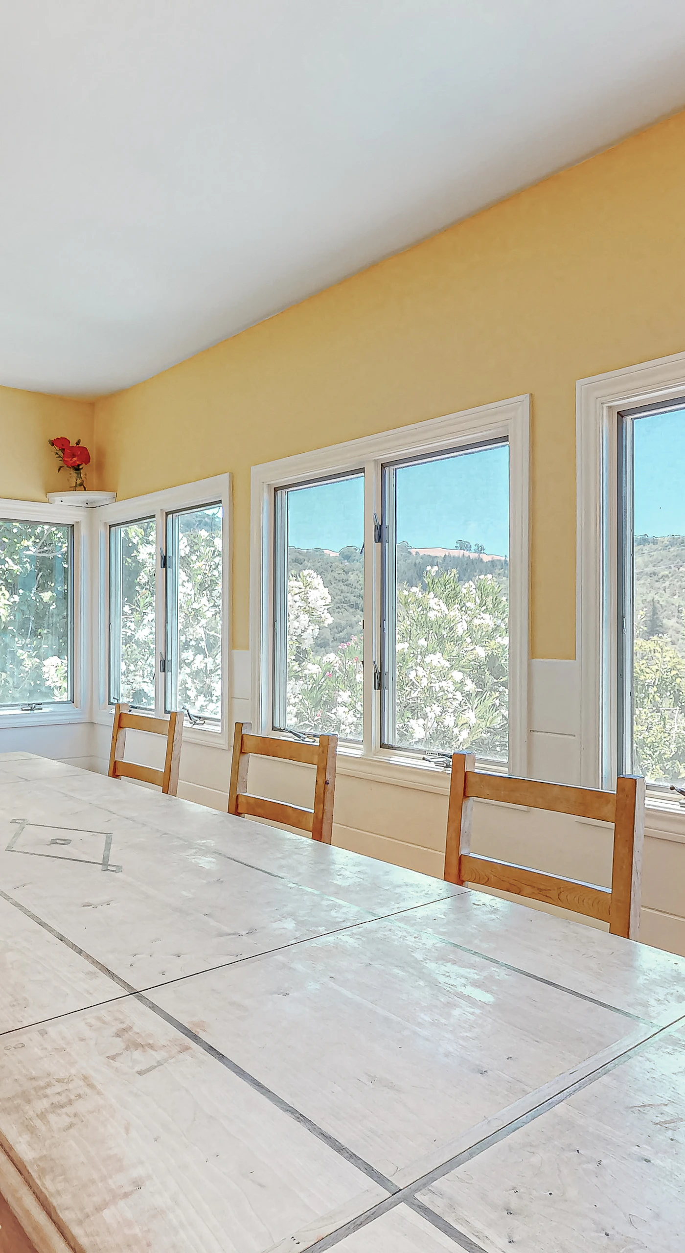 Host a vineyard-inspired feast at the long tiled dining table — walls of windows pour in Healdsburg sunshine while hillside views set the scene for every course.