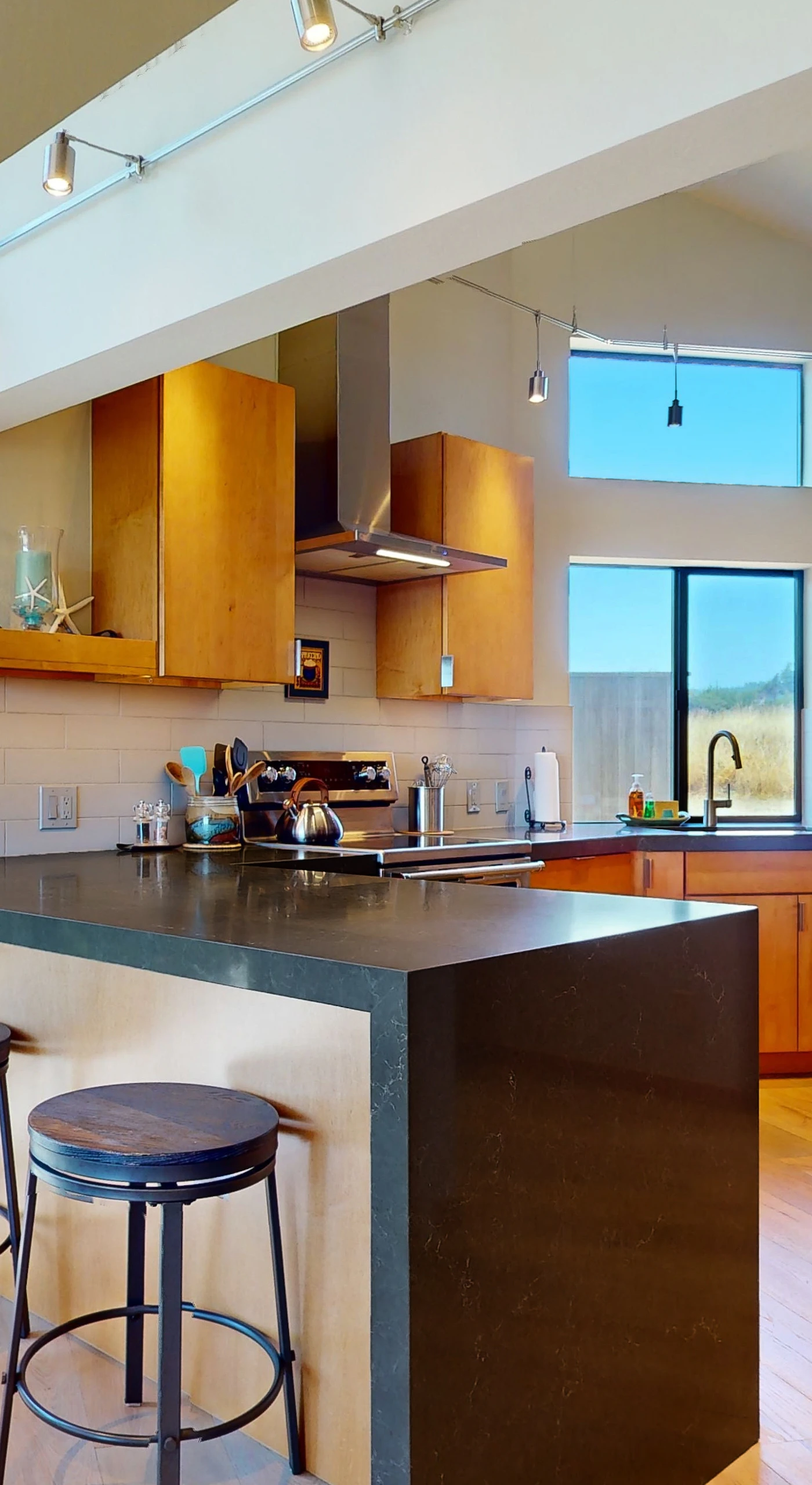 Craft culinary delights in this modern kitchen, where sleek design meets functionality for your cooking adventures.