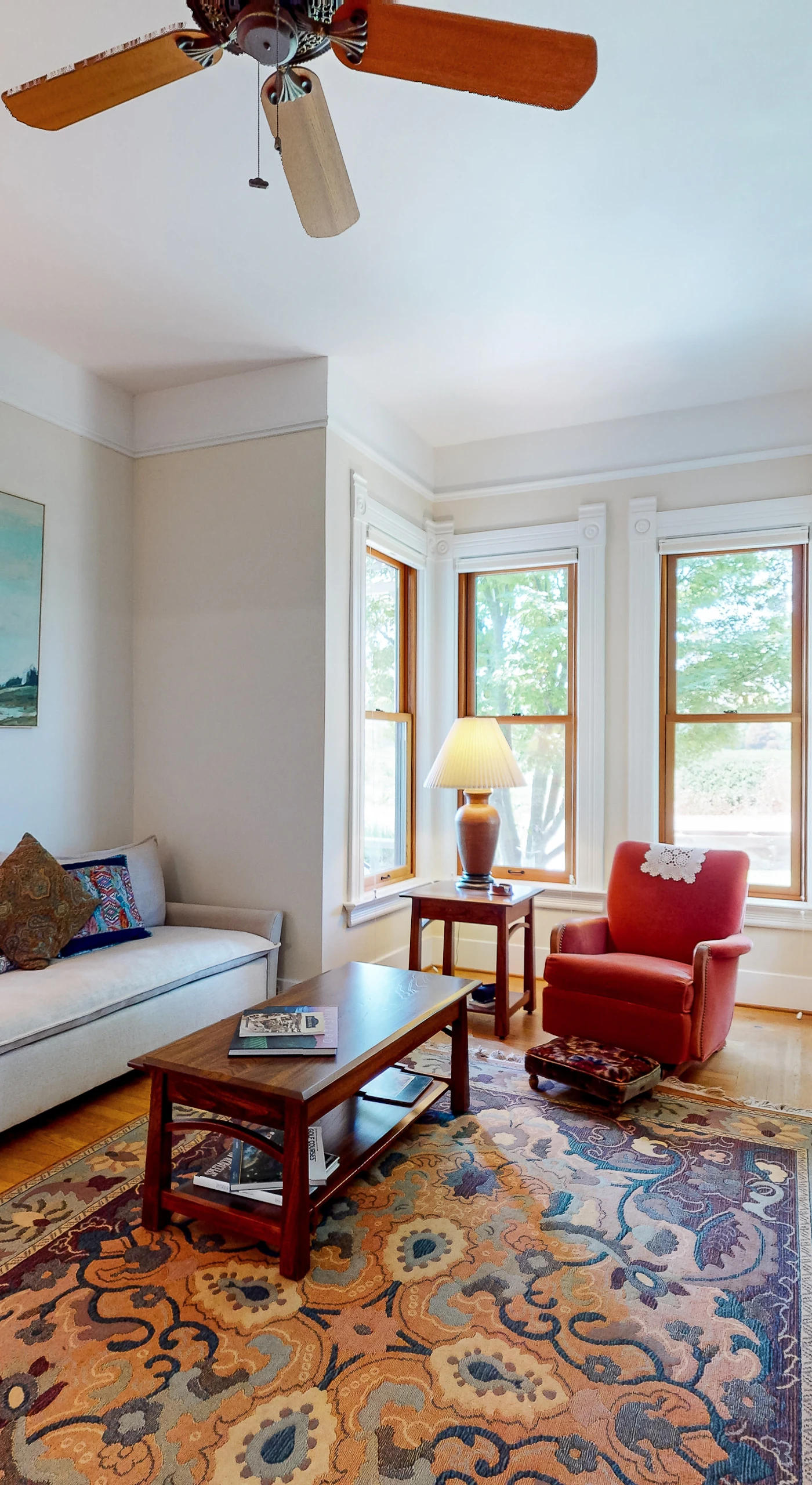 Unwind in your sun-filled living room with a good book from the built-in shelf — bay windows flood this Healdsburg retreat with natural light.