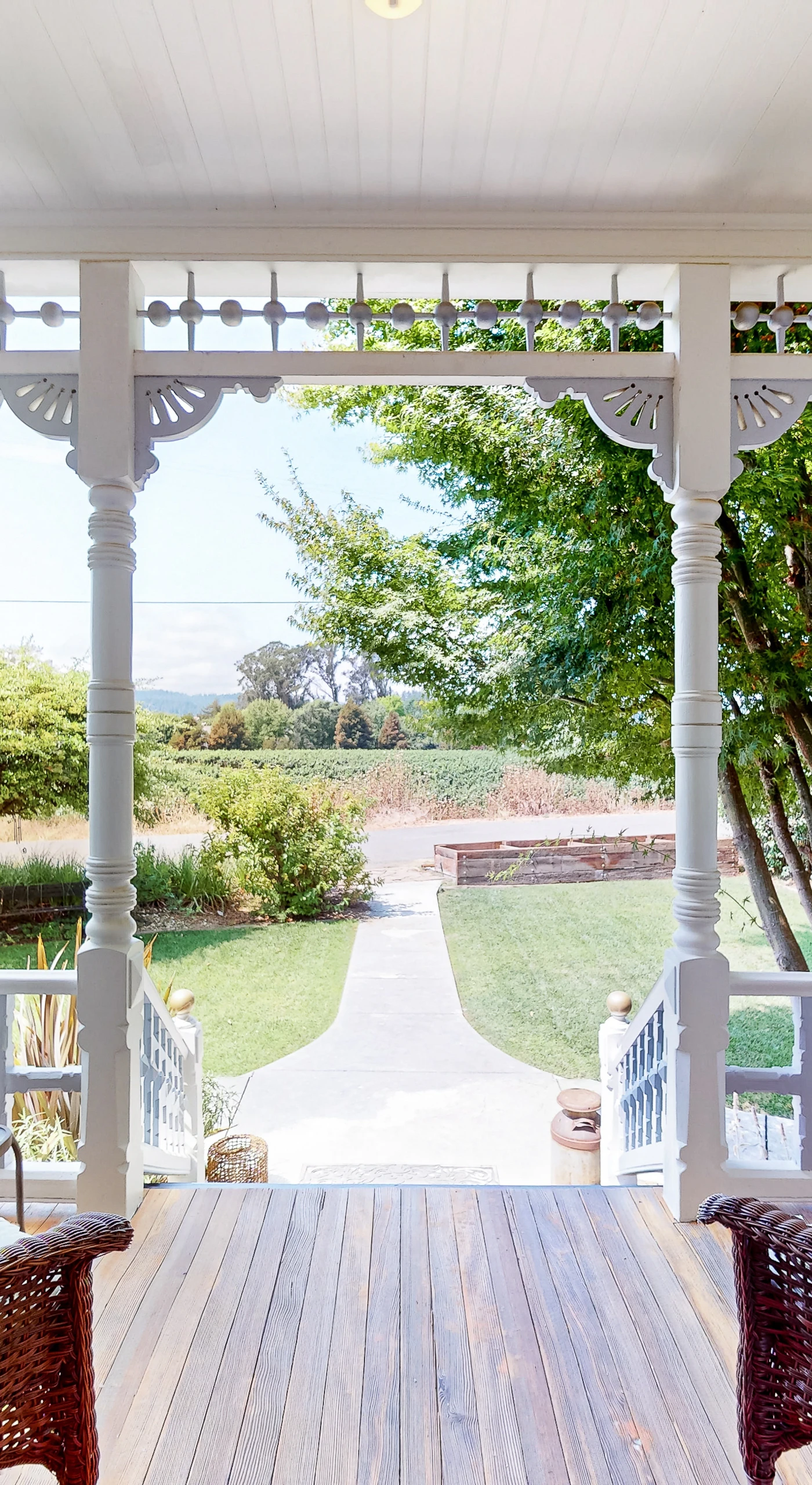 Settle into your private Victorian porch with wicker seating and gaze across the manicured Healdsburg garden — the perfect spot to sip your morning wine country coffee.