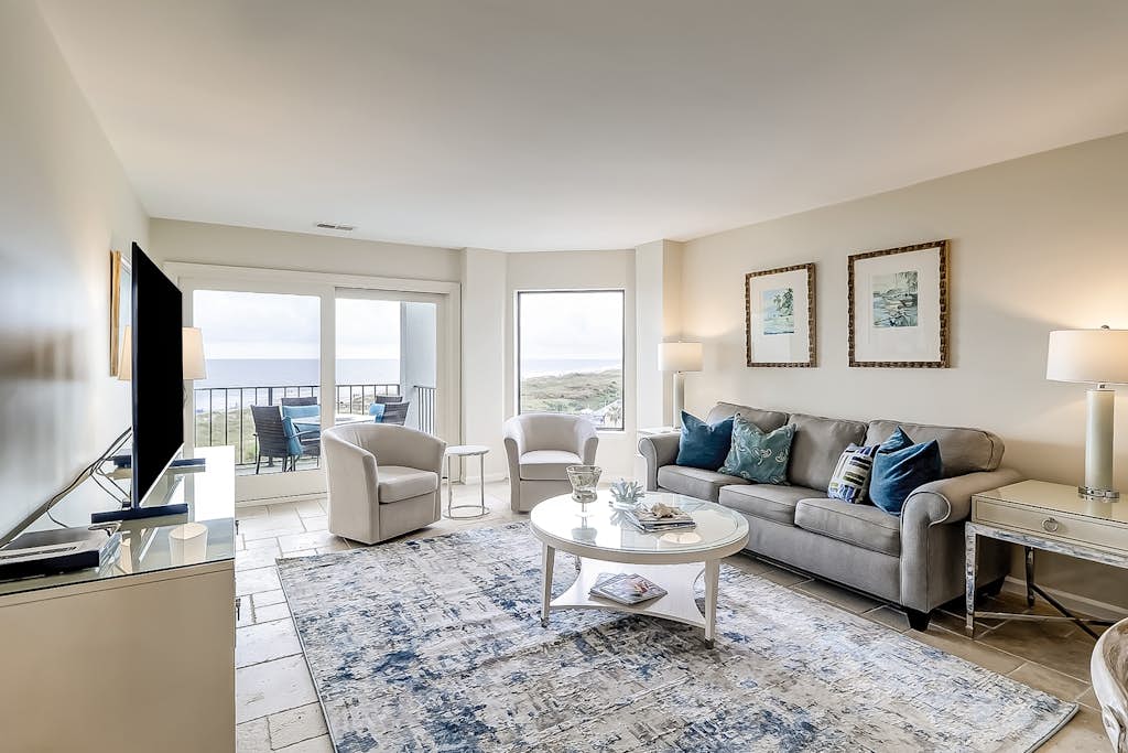 Beach-view 4th-floor condo with balcony, outdoor pool, elevator, BBQ area, W/D — Hilton Head, SC — vacation rental
