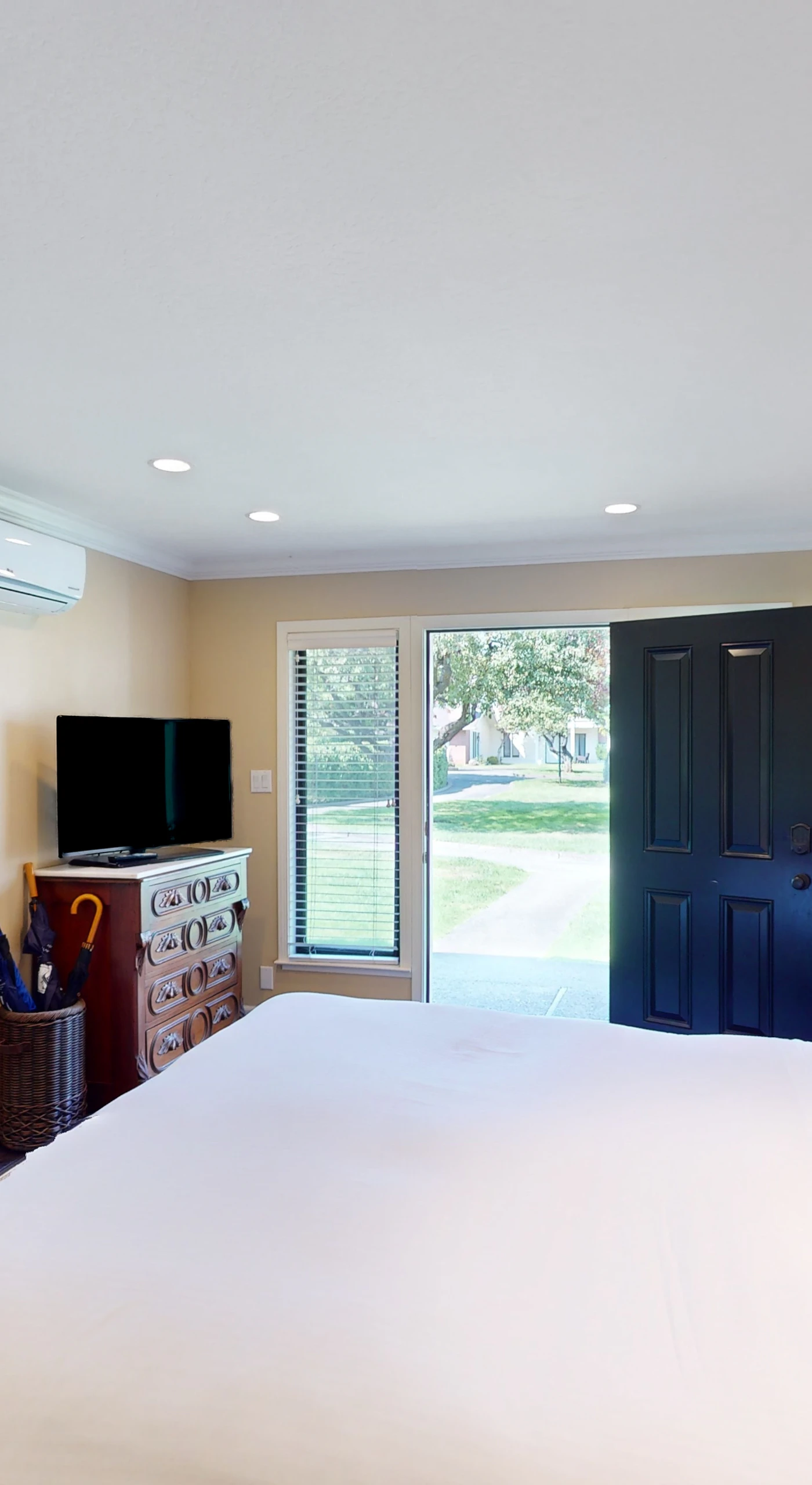 Stretch out in your spacious king suite with flat-screen TV and climate-controlled comfort — glass doors open to Silverado's lush resort grounds.