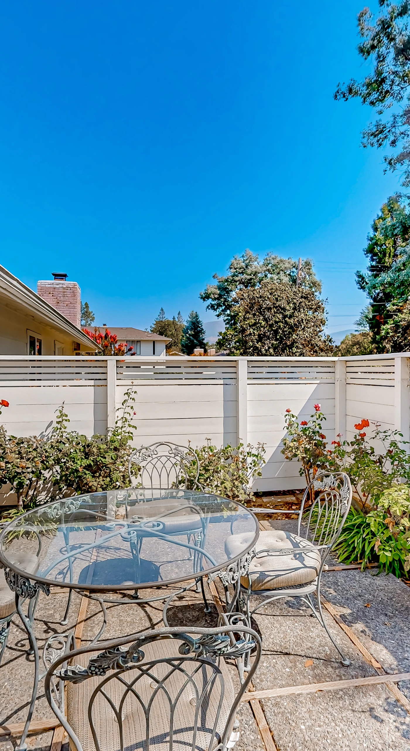Savor your morning coffee on your private patio with wrought iron bistro seating, blooming roses, and Napa Valley sunshine at your doorstep