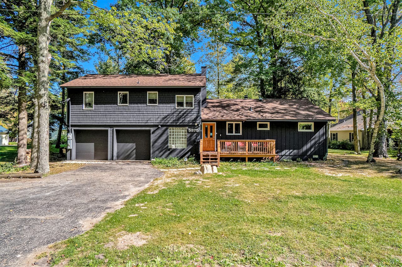 Whispering River Hideaway 4 BD Honor, MI Vacation Rental Vacasa