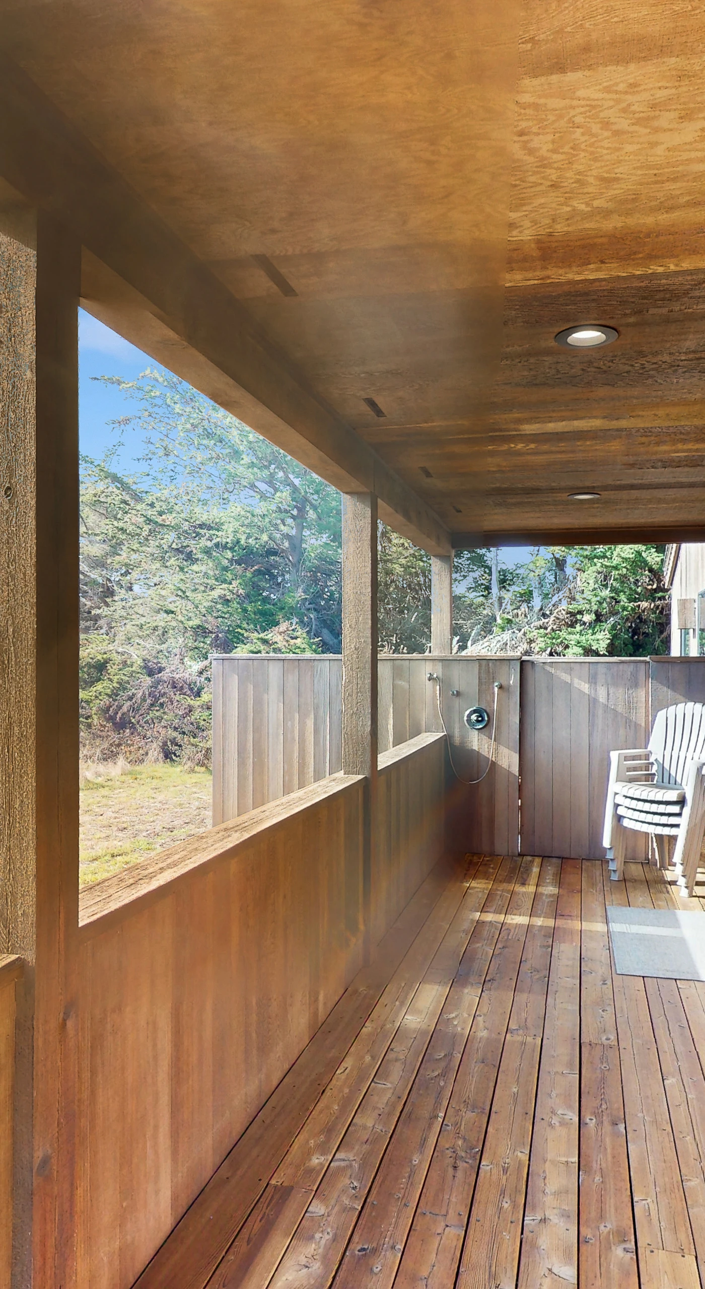 Perfect for lazy afternoons, this spacious deck invites you to unwind with a good book or share laughter with friends.