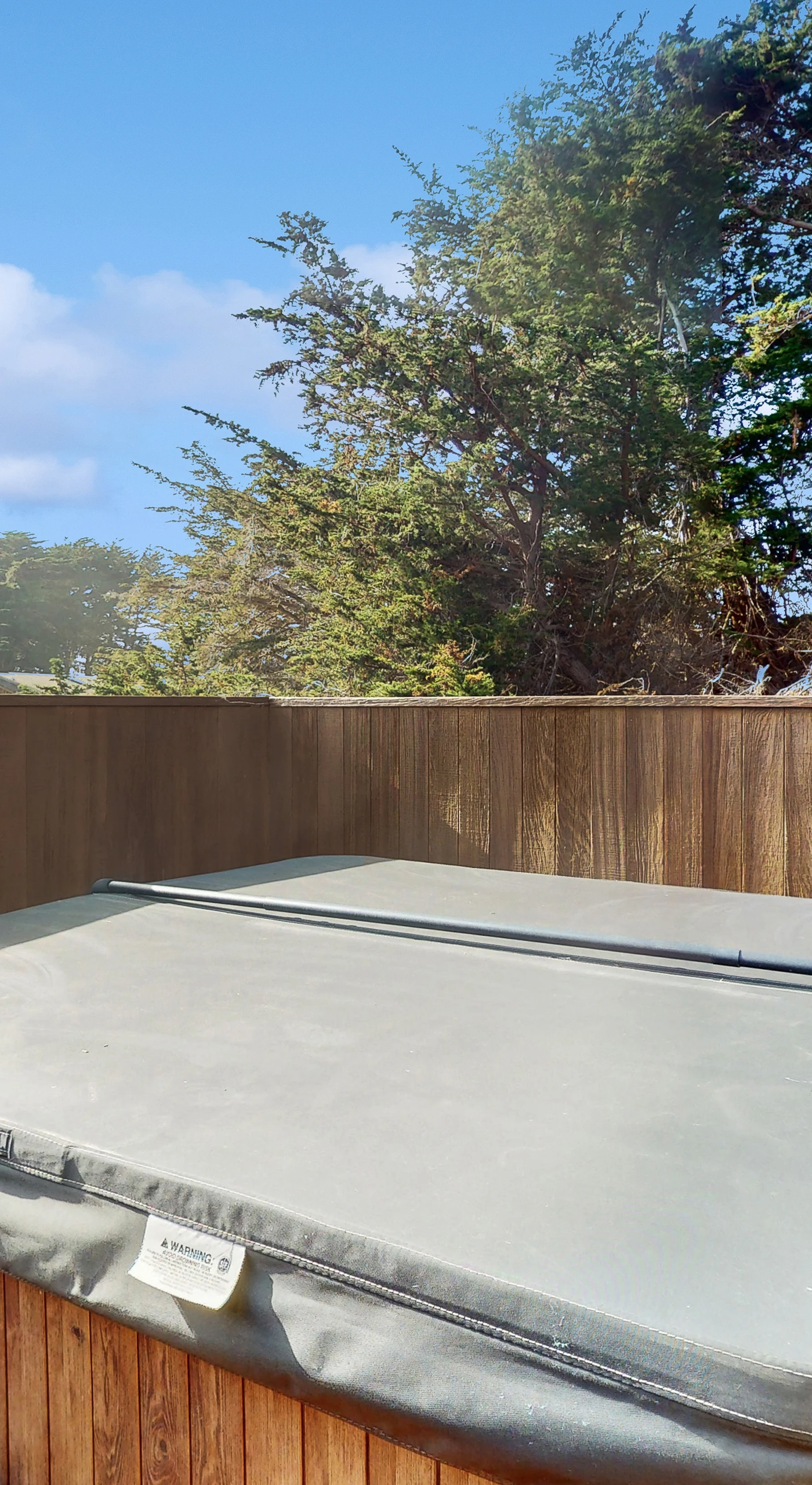 Your private hot tub awaits, offering a perfect retreat to unwind under the stars after a day of coastal adventures.