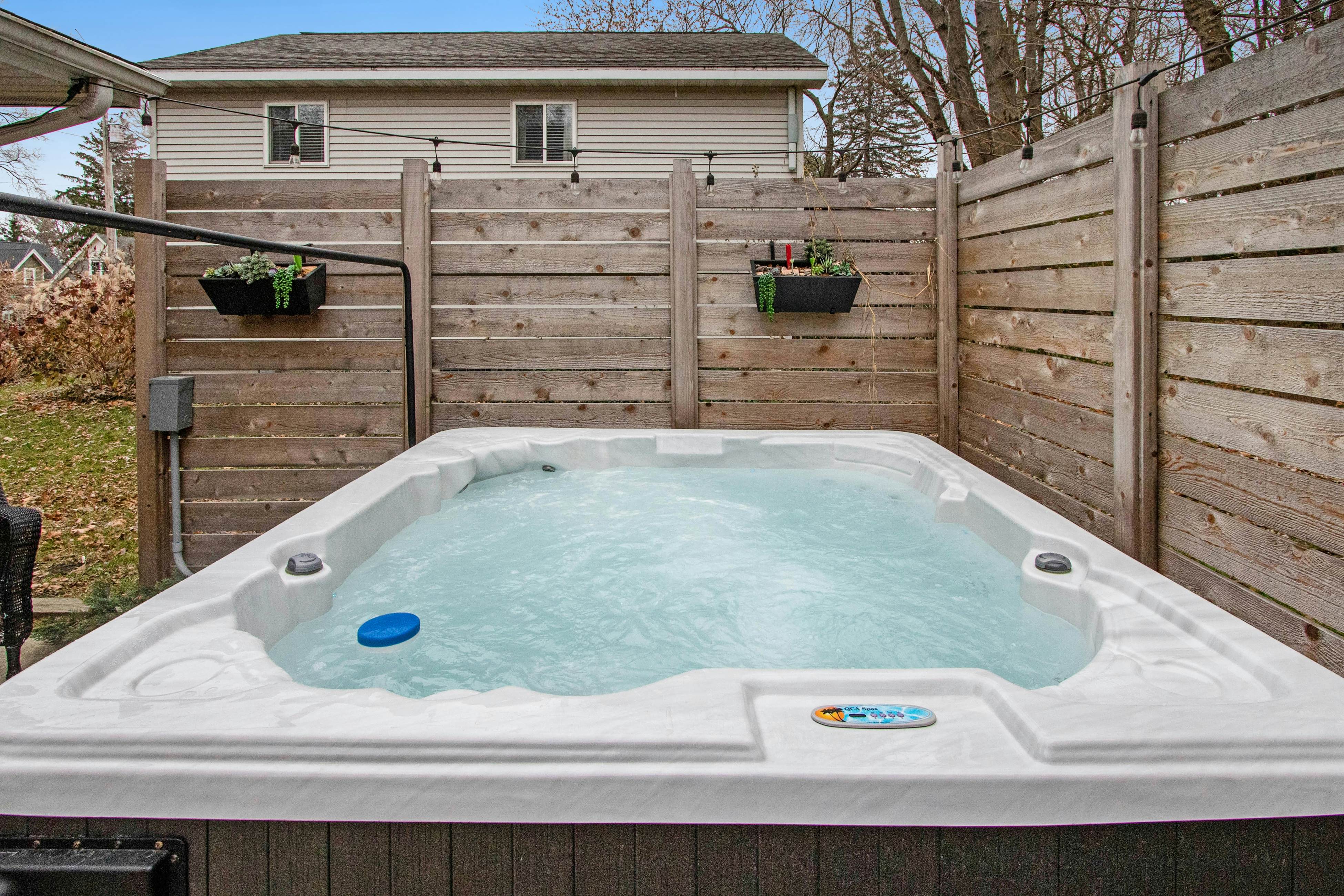 Merchant Street Pool Retreat with a  Year-Round Hot Tub.