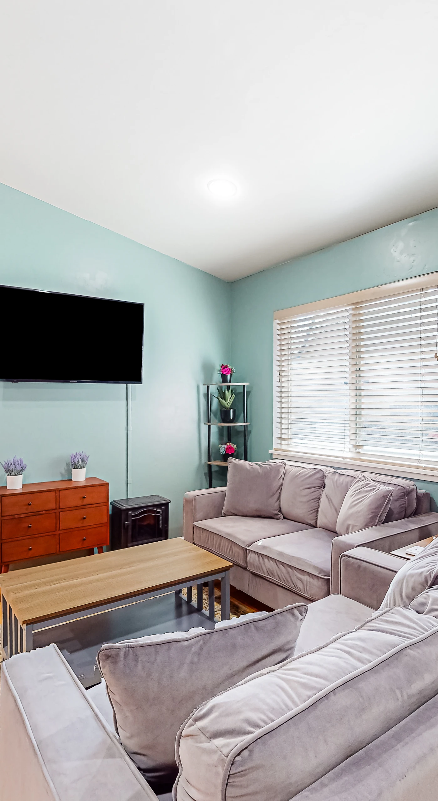 Sink into your plush sofa and stream your favorites on the wall-mounted TV — this sunlit living room with hardwood floors is your cozy basecamp between Russian River adventures.