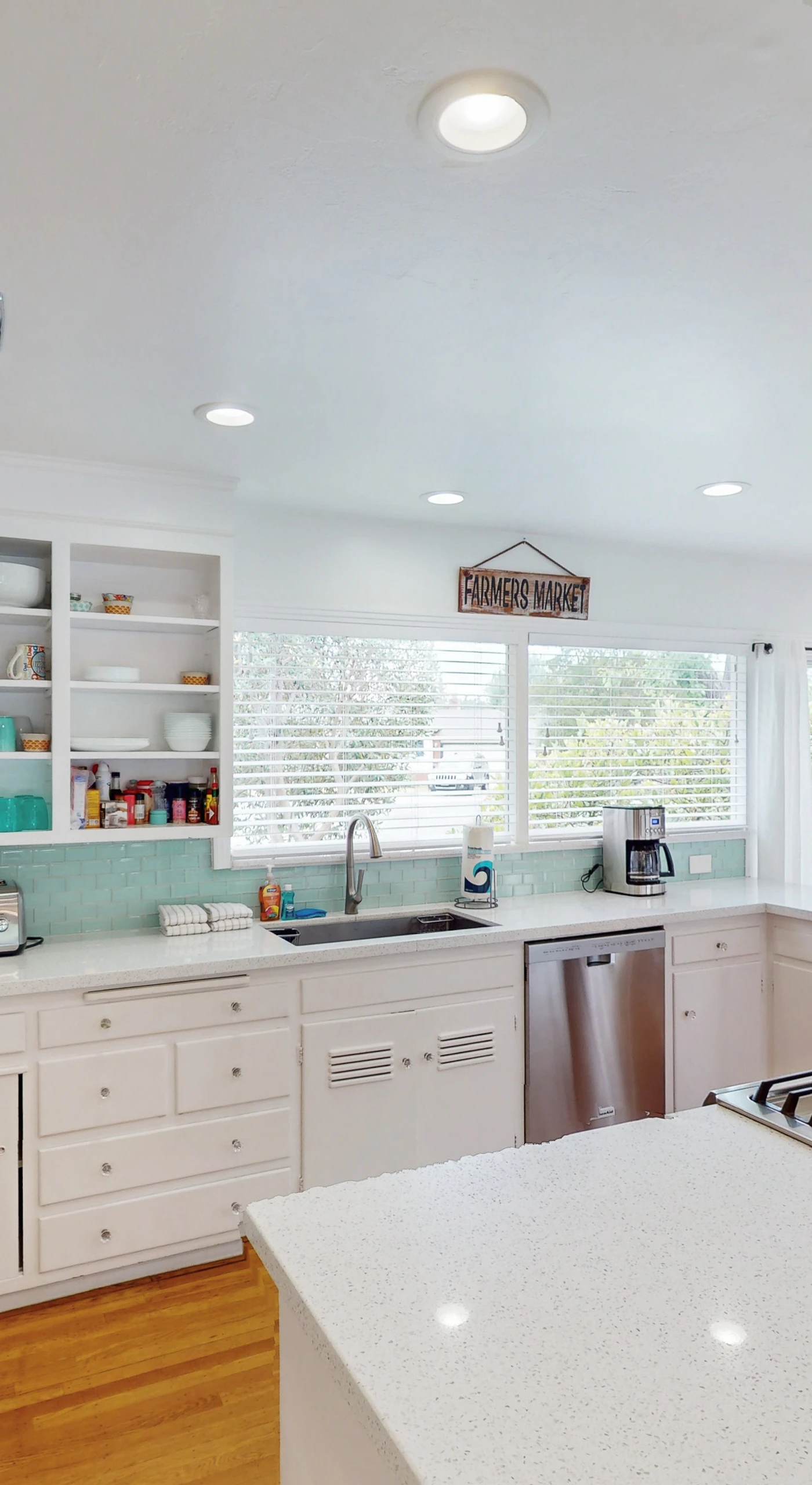Channel your inner chef in your fully equipped kitchen — a gas cooktop island, open shelving, and hanging copper pans make preparing wine-country-inspired meals a pleasure.