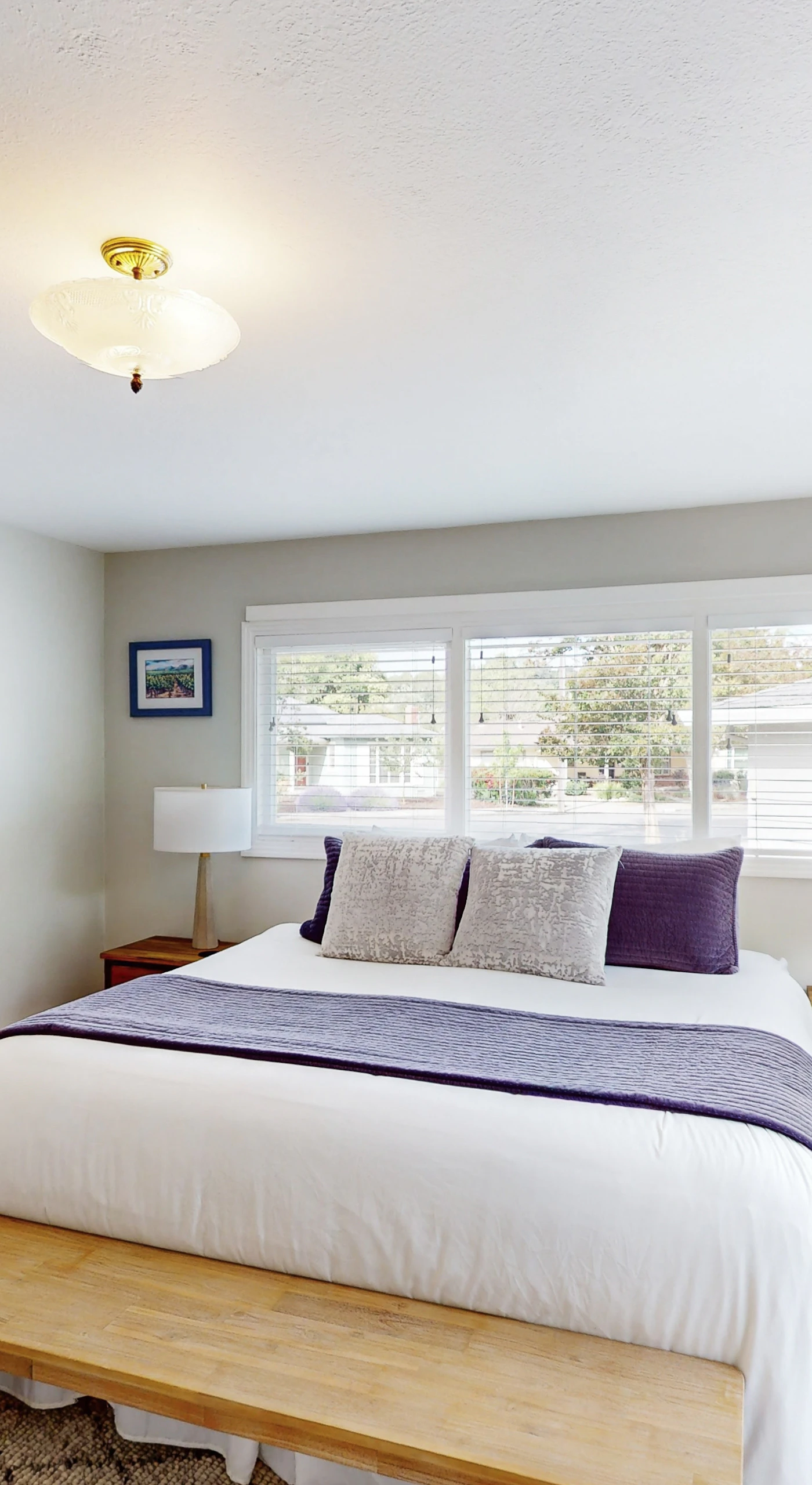Drift off in your king-size bed with crisp linens and garden views — step through the glass door to your private patio or into the en-suite bath after a day exploring Sonoma.