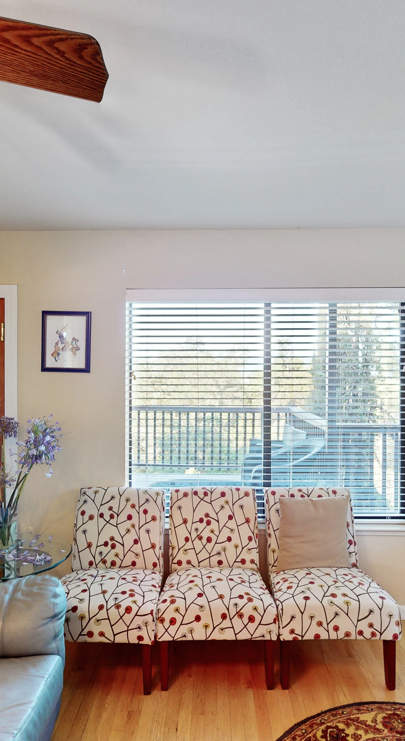 Natural light pours through oversized windows into your airy sitting area — grab a book or plan tomorrow's tasting room itinerary from the comfort of the couch.