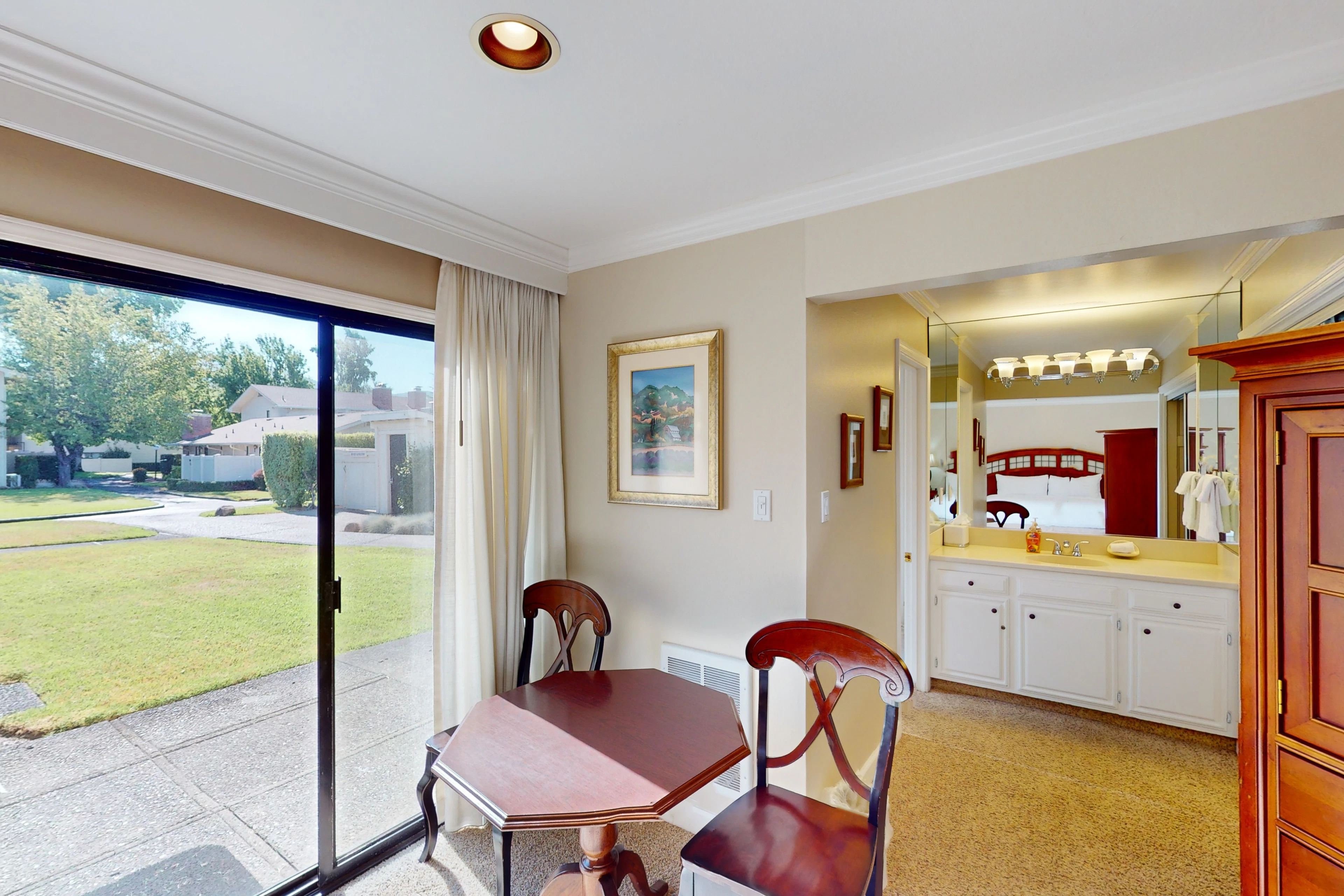 Settle into your private dining nook overlooking Silverado's manicured greens — sliding glass doors flood your Napa retreat with natural light