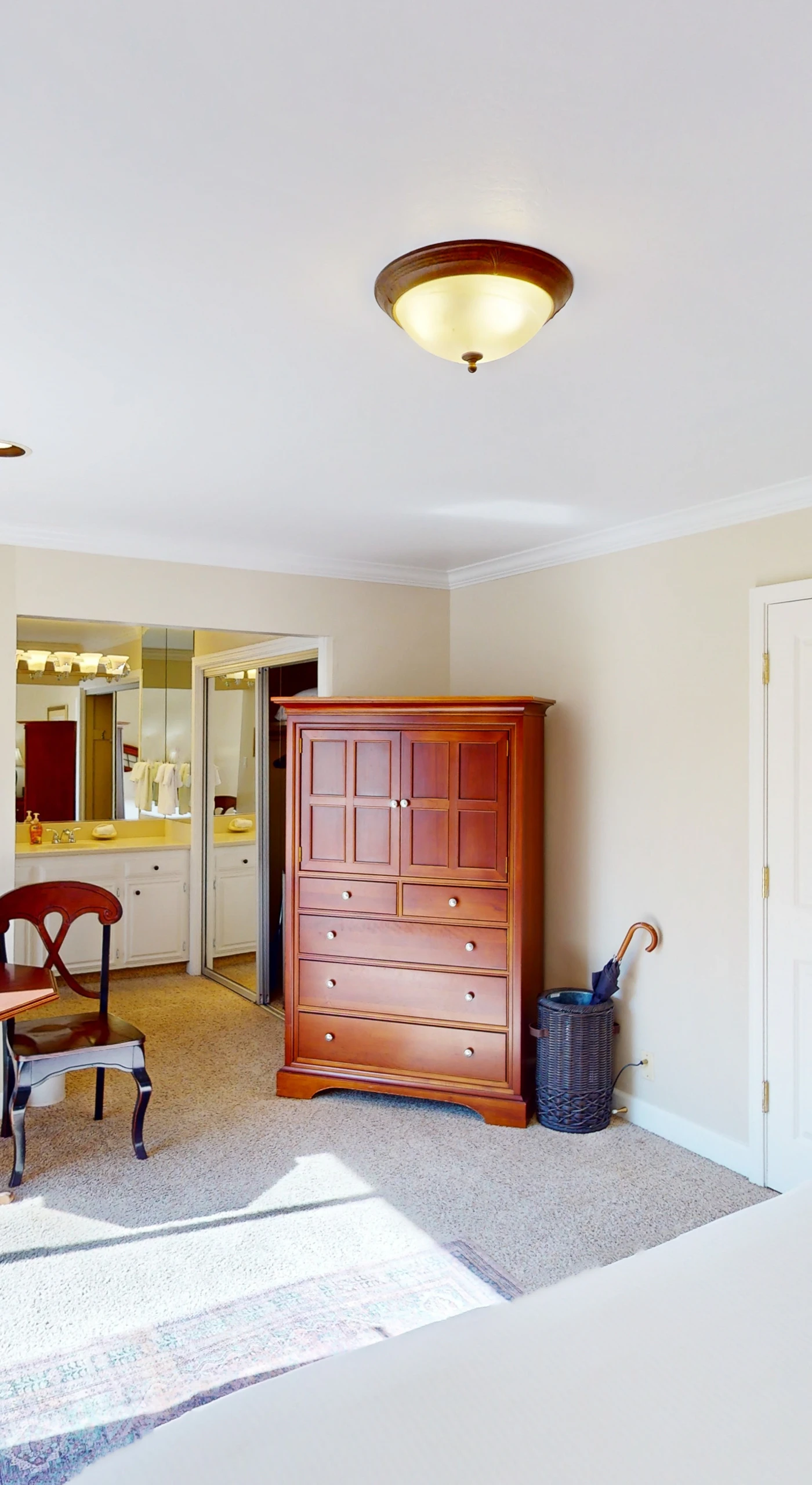 Take in the full layout of your Napa Valley suite — king bed, dining nook, and patio access all in one sunlit space