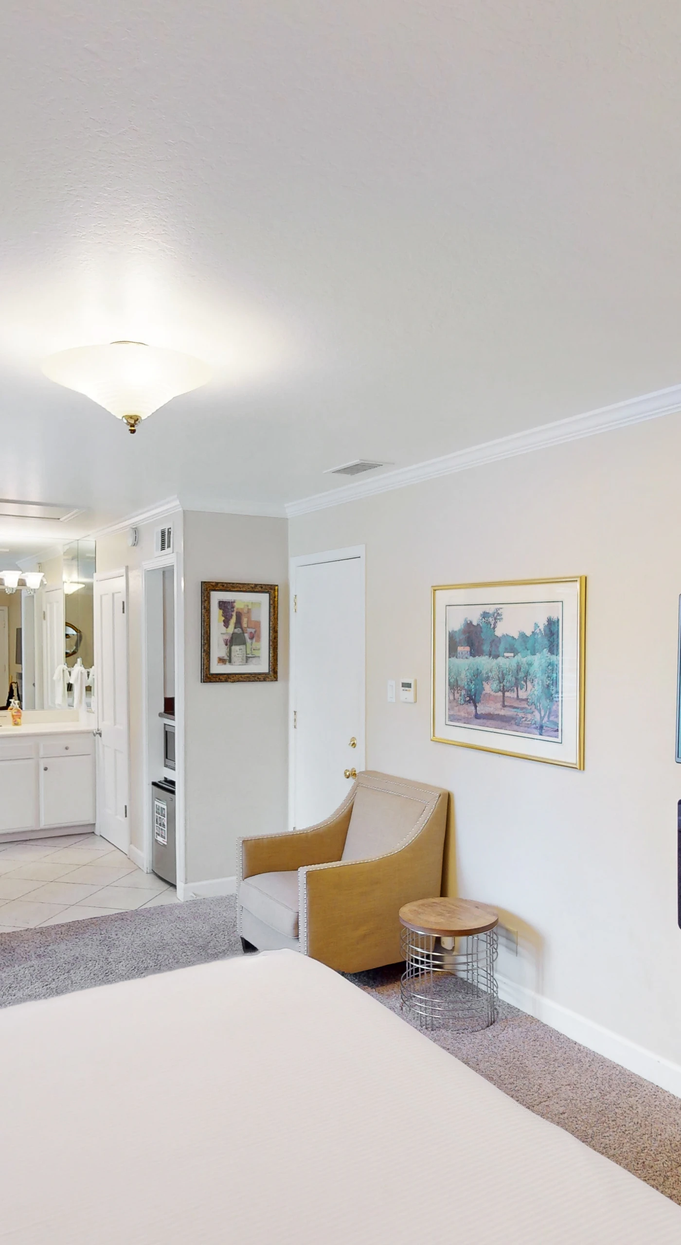 Take in the full scope of your Silverado suite — from your king bed and fireplace to the intimate dining nook and open vanity area, every detail invites relaxation.