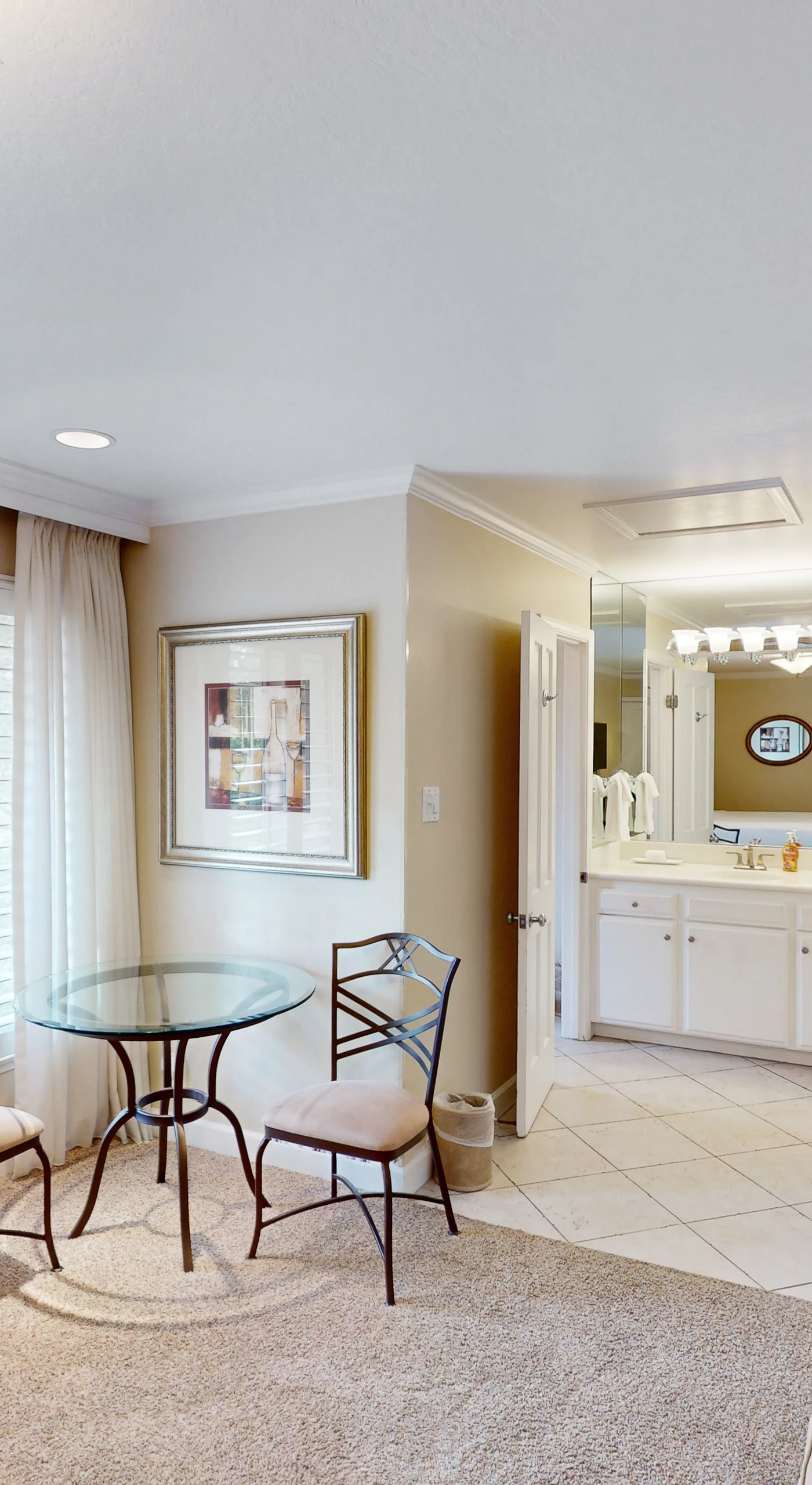 Plan your Napa Valley itinerary at the glass-topped bistro table while morning light filters through plantation shutters — your private dining nook for two.