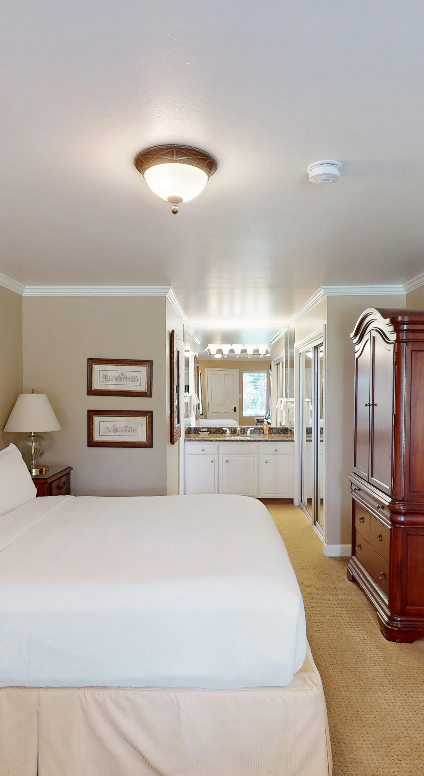 Sink into your plush king bed with crisp white linens — elegant wood furnishings set the tone for a restful Napa getaway