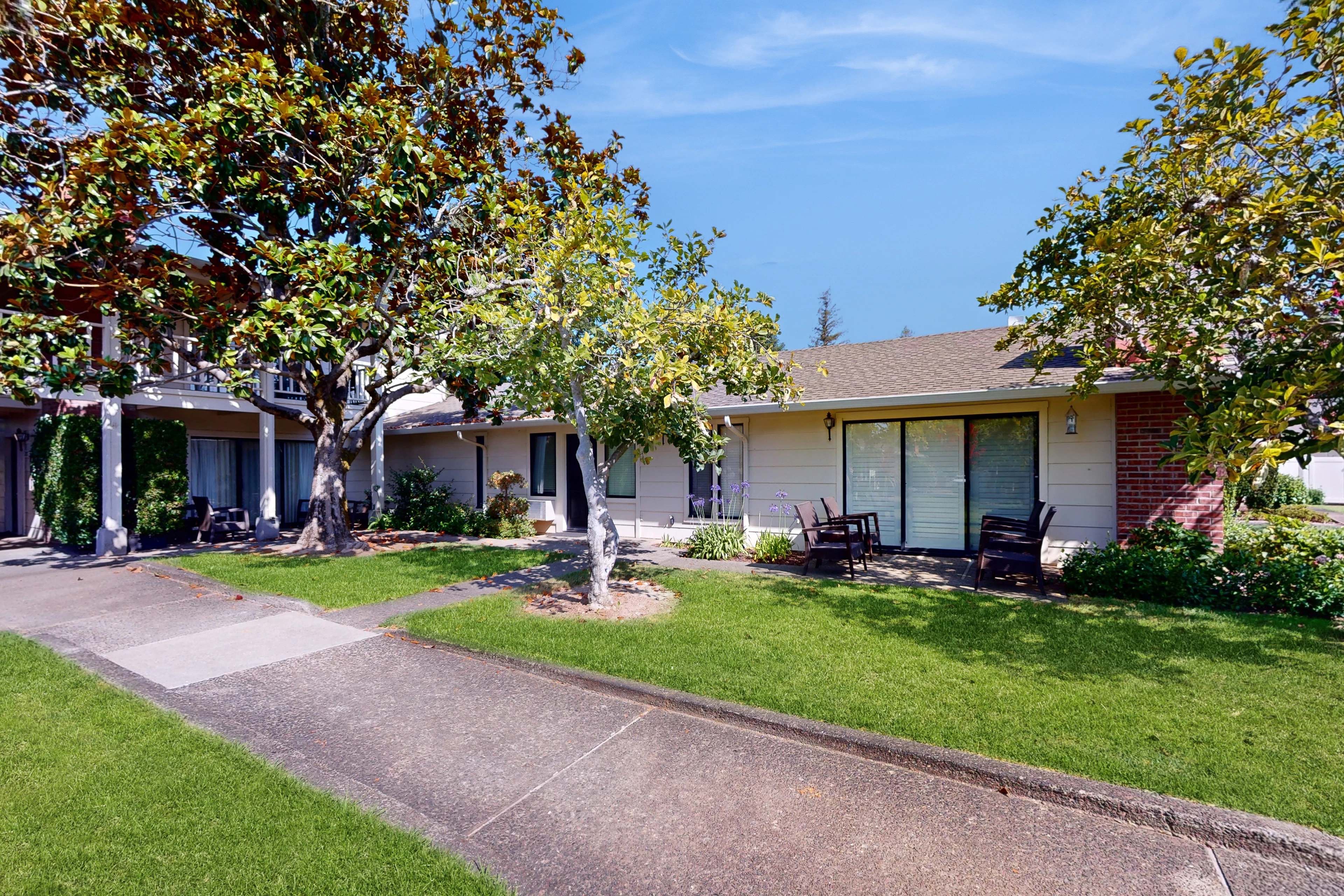 Welcome to your Napa Valley retreat at Silverado Resort — a charming single-story suite surrounded by manicured lawns and mature shade trees