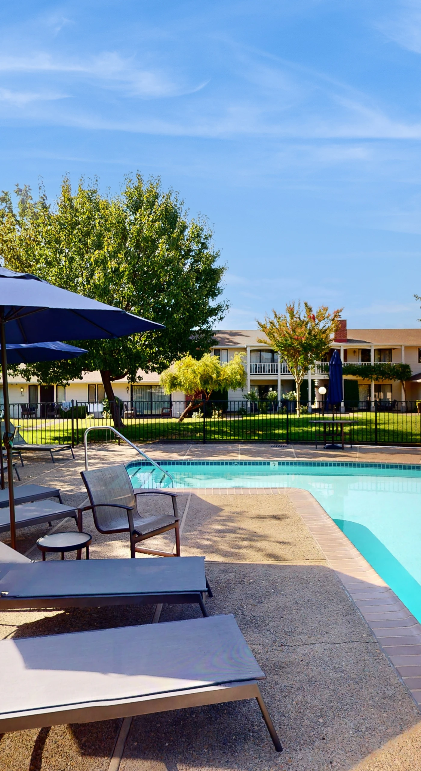 Cool off in your resort pool after a day of Napa wine tasting — lounge chairs and shaded umbrellas await your afternoon unwind