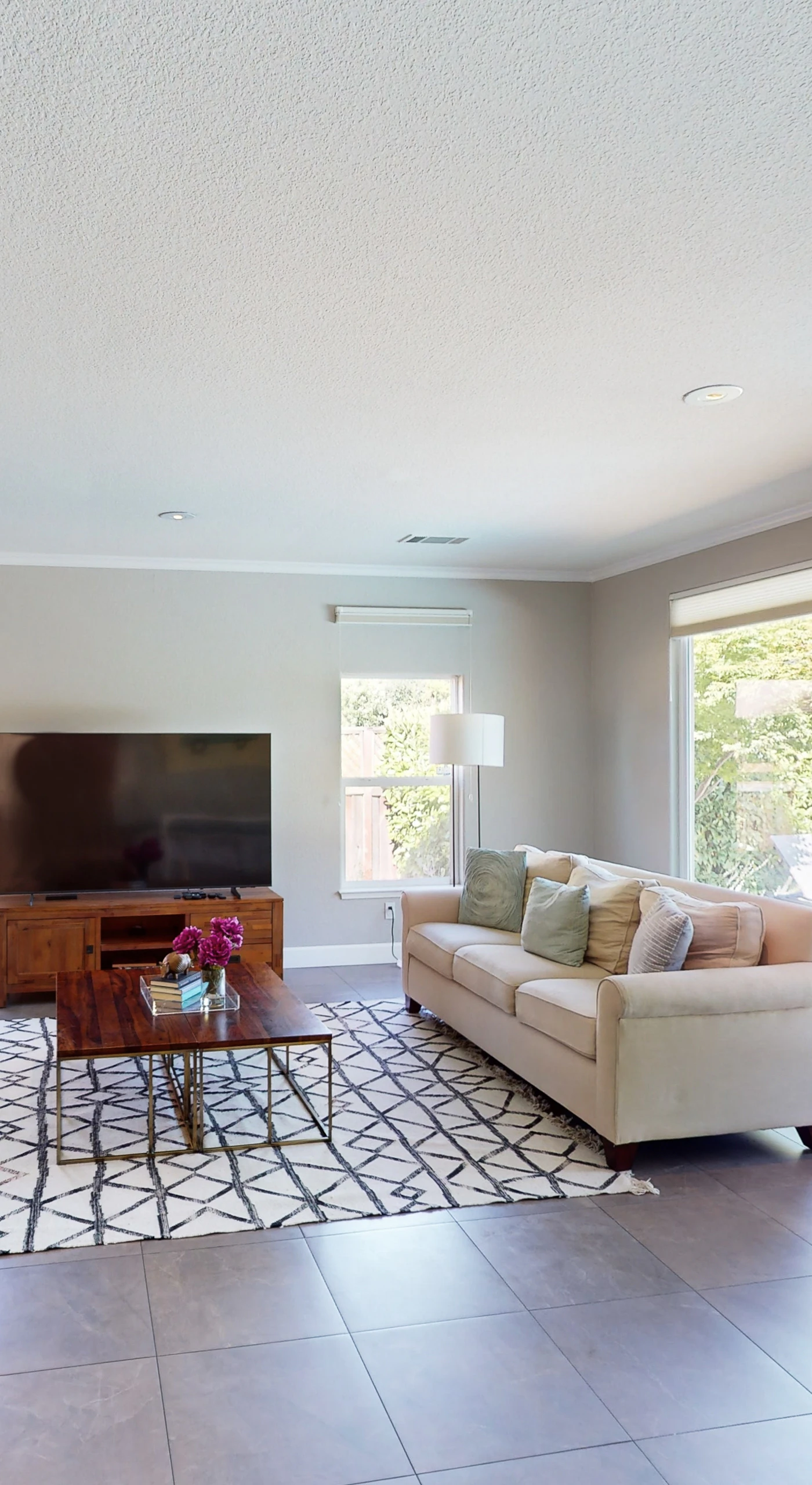 French doors flood your living room with natural light and open directly to the pool — grab a glass of Sonoma red and drift between indoors and out.