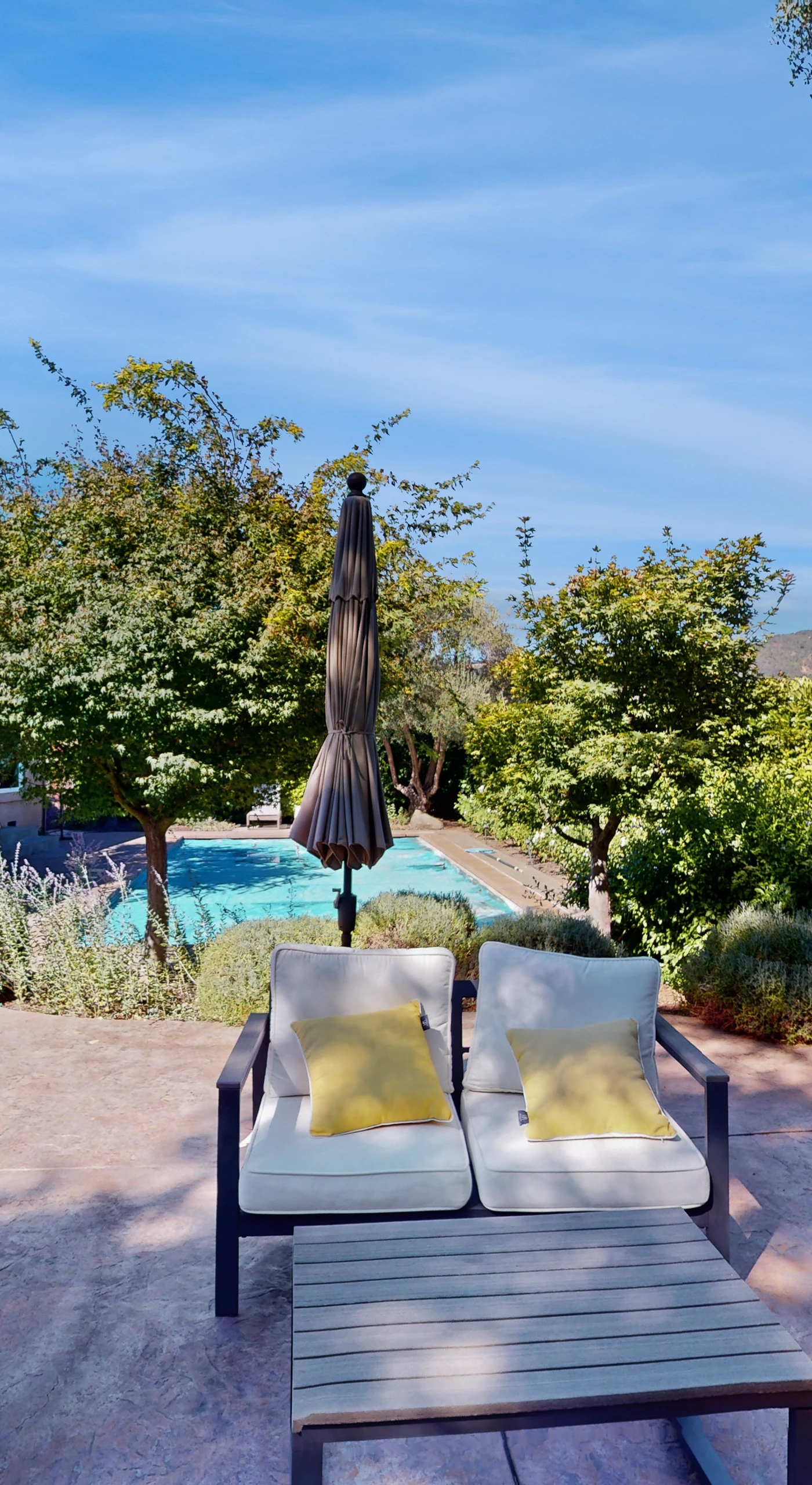 Settle into your private patio lounge with plush seating, poolside shade, and manicured Sonoma Valley landscaping — your wine country retreat starts right here.