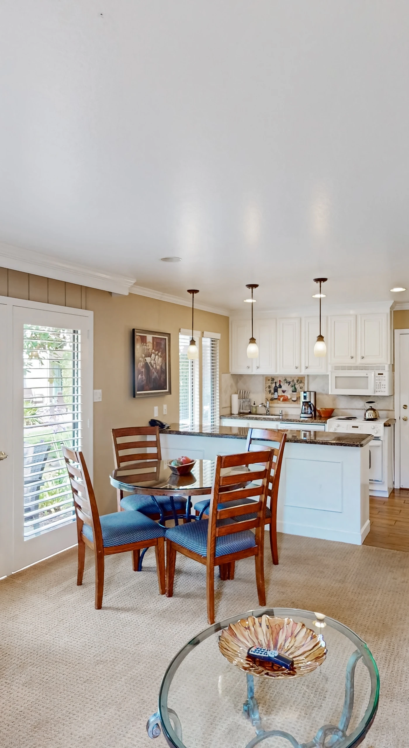 Gather your group in the bright open-concept living and dining space with views of the resort grounds through oversized windows