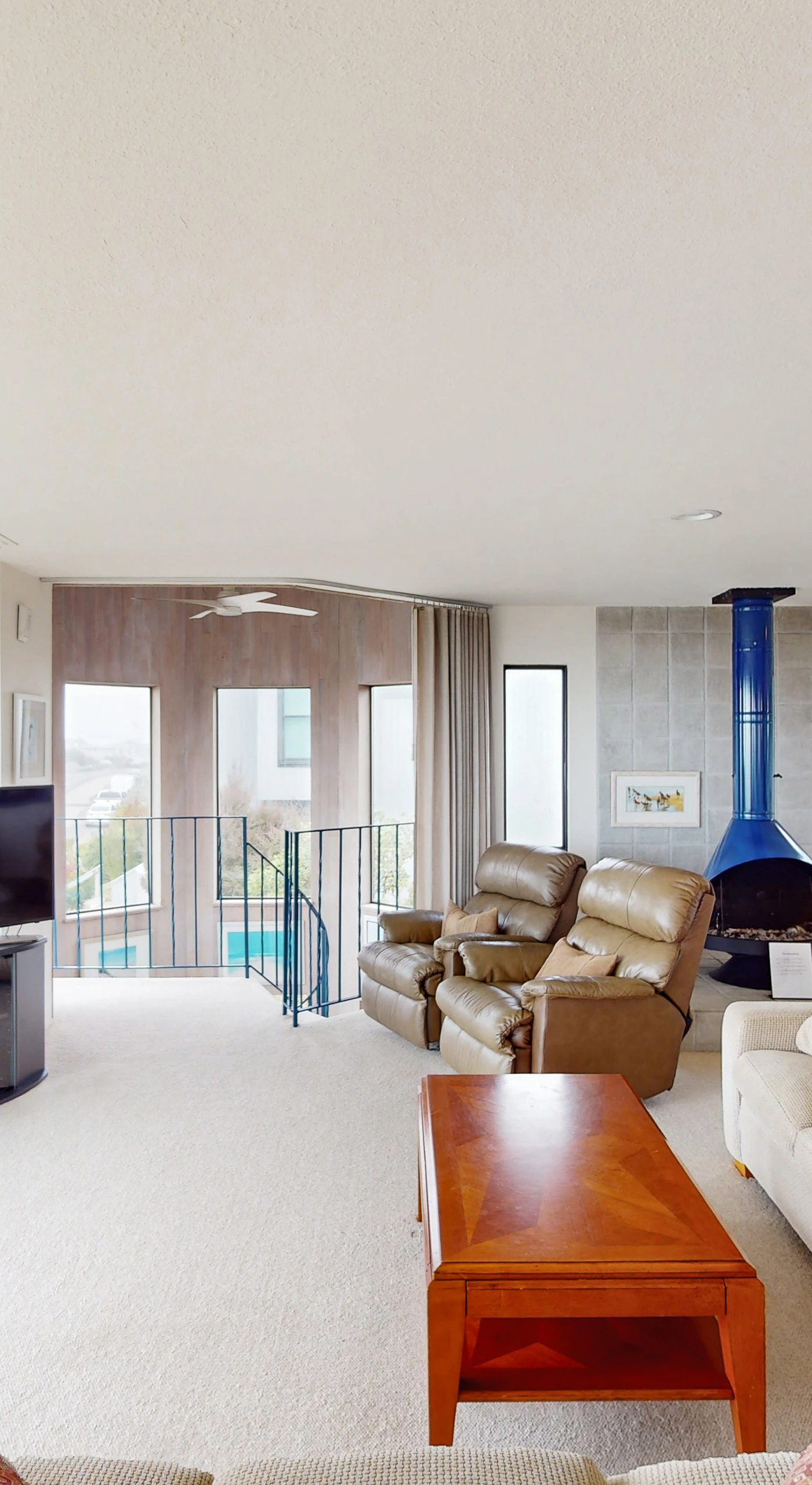 Warm your evenings by the striking blue gas fireplace while Bodega Bay's coastal beauty unfolds through your wraparound windows and balcony