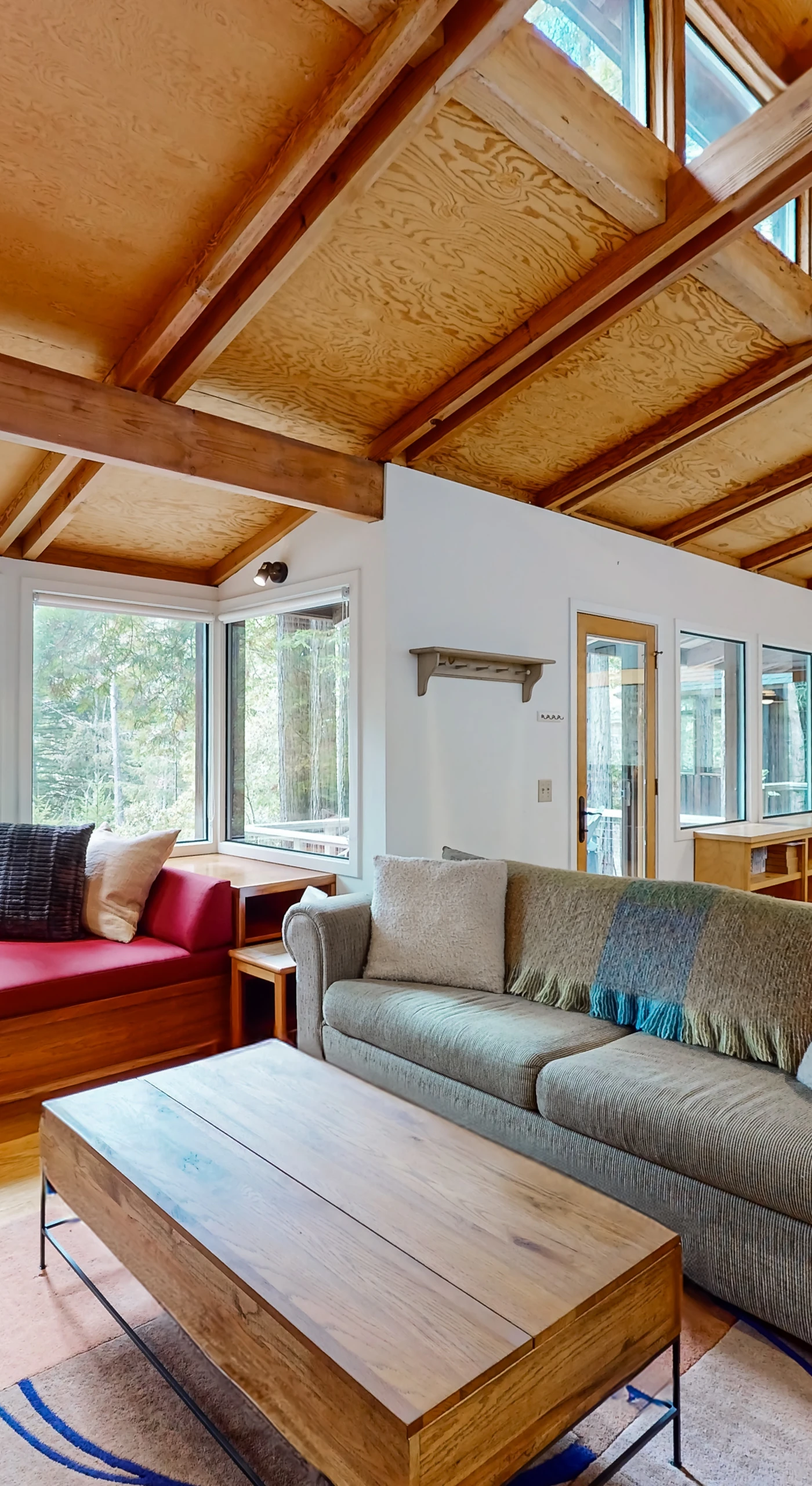 Natural light floods the spacious living room, inviting you to relax on plush seating after a day of exploring.