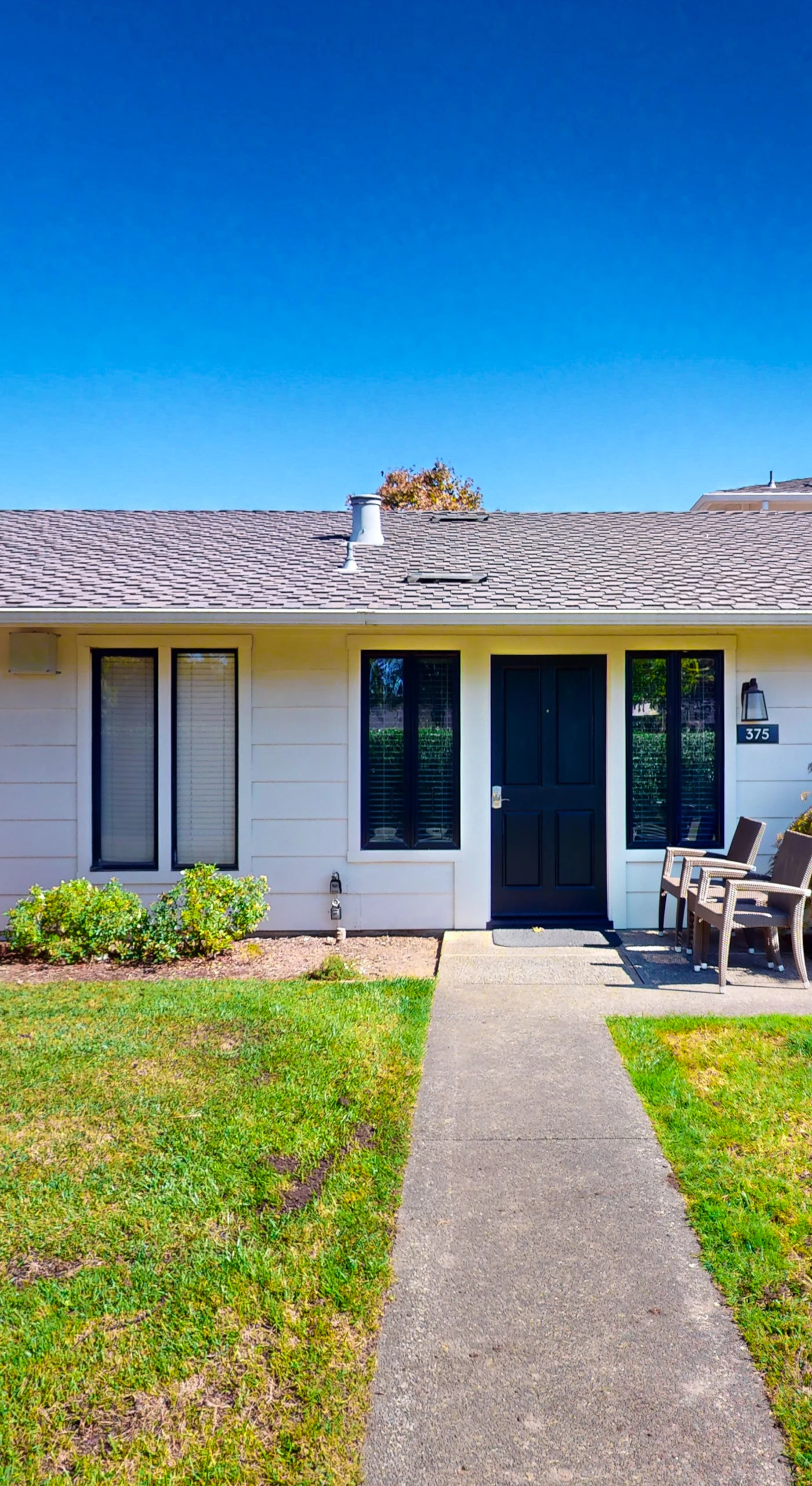 Welcome to your private Napa Valley cottage — step through the front door of Unit 375 to find a single-level retreat with sunny patio seating and manicured resort lawns.